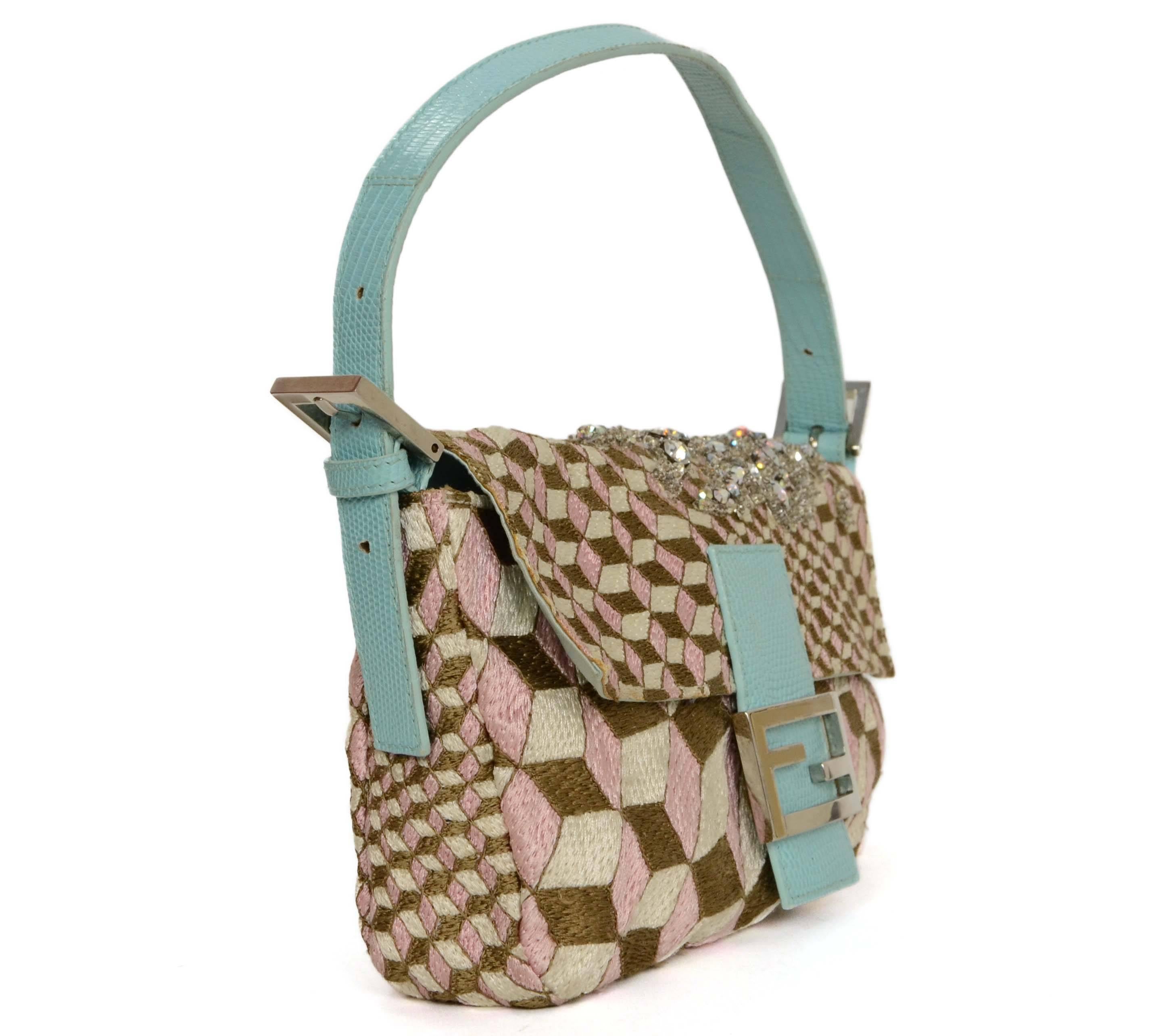 Features cube print with crystal and bead detailing over the top and back of the bag.  Baby blue lizard trim completes the delicate, yet sophisticated look.

-Made In: Italy
-Color: Brown, cream, pink and blue
-Hardware: Silvertone
-Materials: