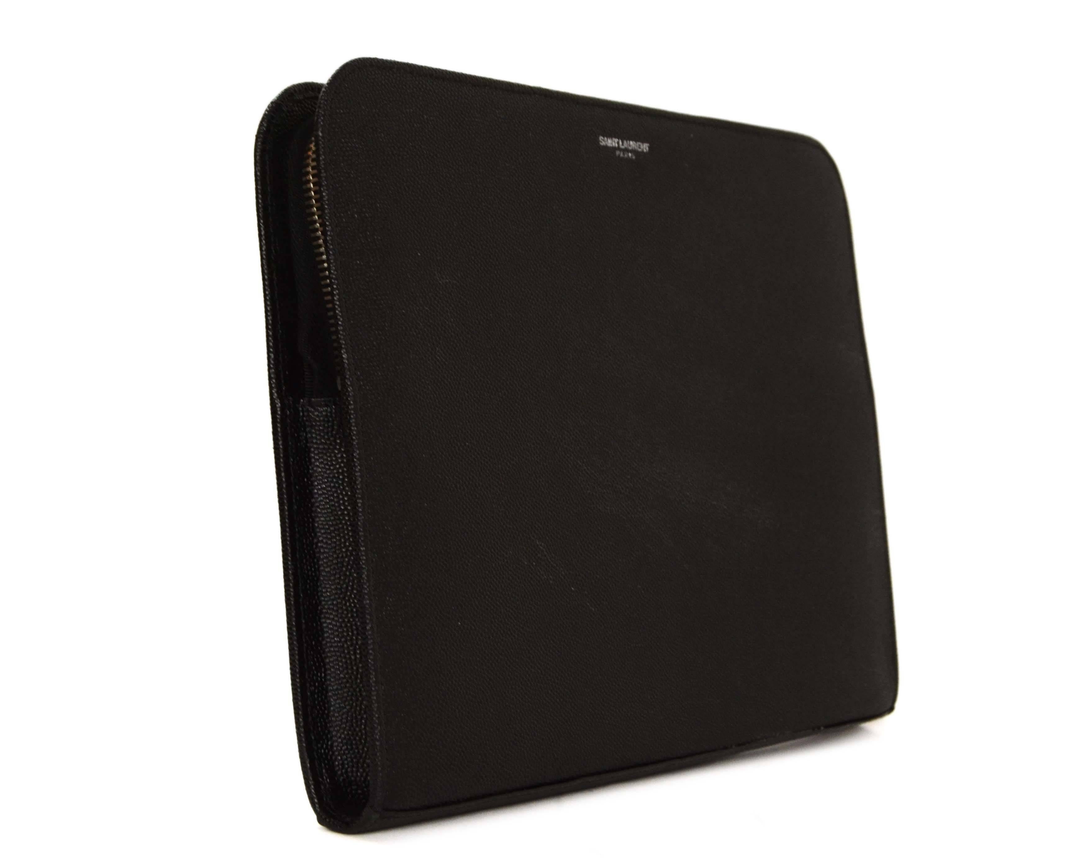Features textured leather making bad more durable. This accessory is meant to be a case for an iPad but can double as a great, functional clutch!

-Made In: Italy
-Circa: 2015
-Color: Black
-Hardware: Silvertone
-Materials: Calf leather