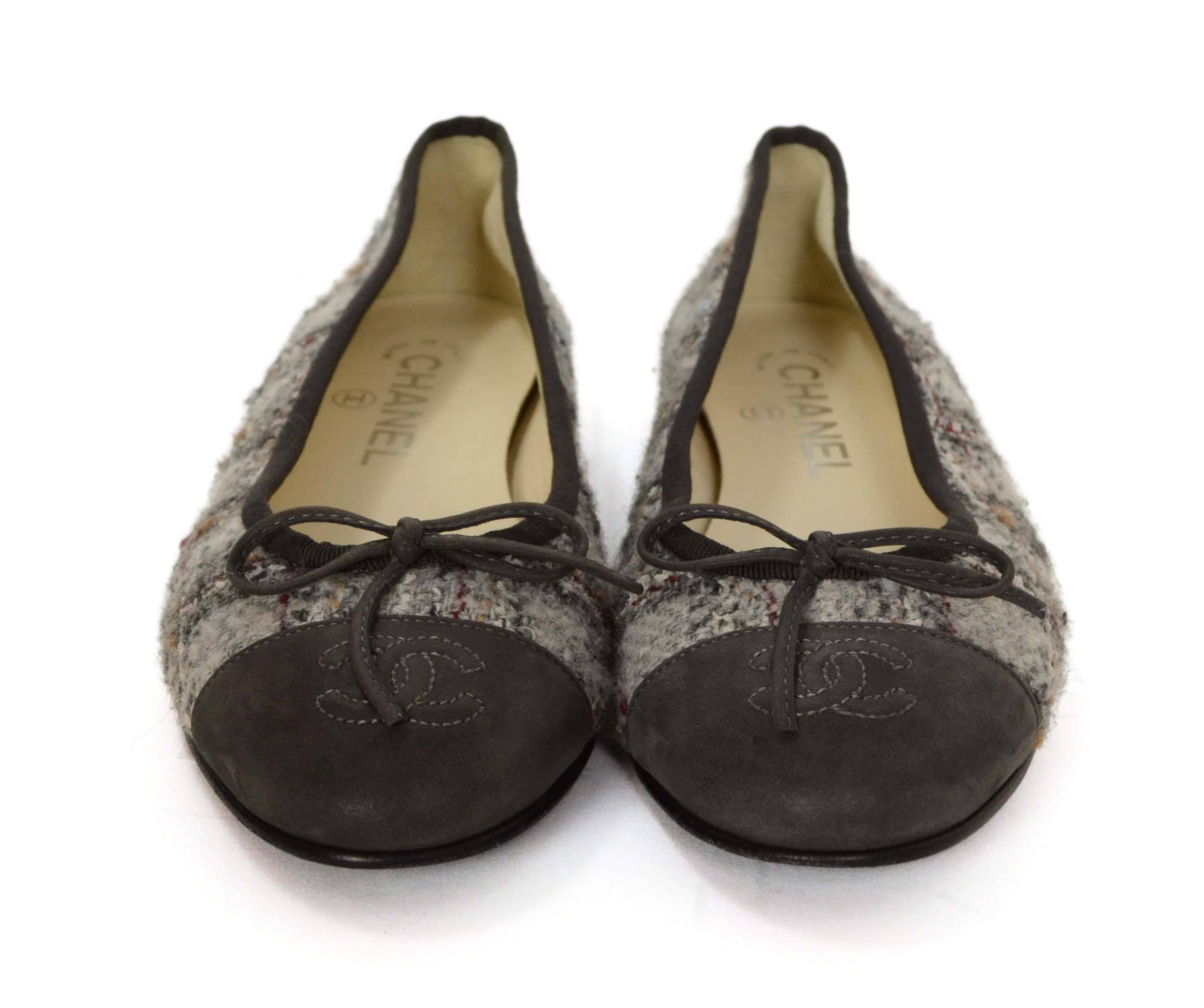 Features grey, red, blue and beige tweed with grey sueded toe cap with embossed CC

-Made In: Italy
-Year of Production: 2013
-Color: Grey with red, beige and blue accents
-Materials: Tweed, canvas and leather
-Closure/Opening: Slide on