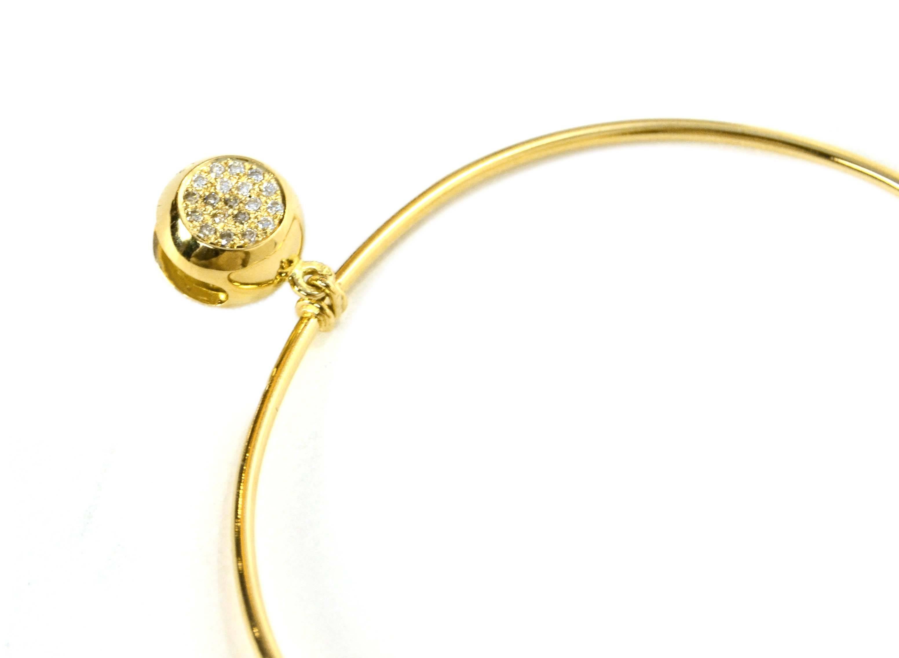 Features bell charm with diamonds on both sides.  One side has engraved clover surrounded by diamonds. 

-Color: Gold
-Materials: 18k gold and pave diamonds
-Closure: Hook
-Stamp: Aurelie Bidermann 750
-Retail Price: $4,200 + tax
-Overall