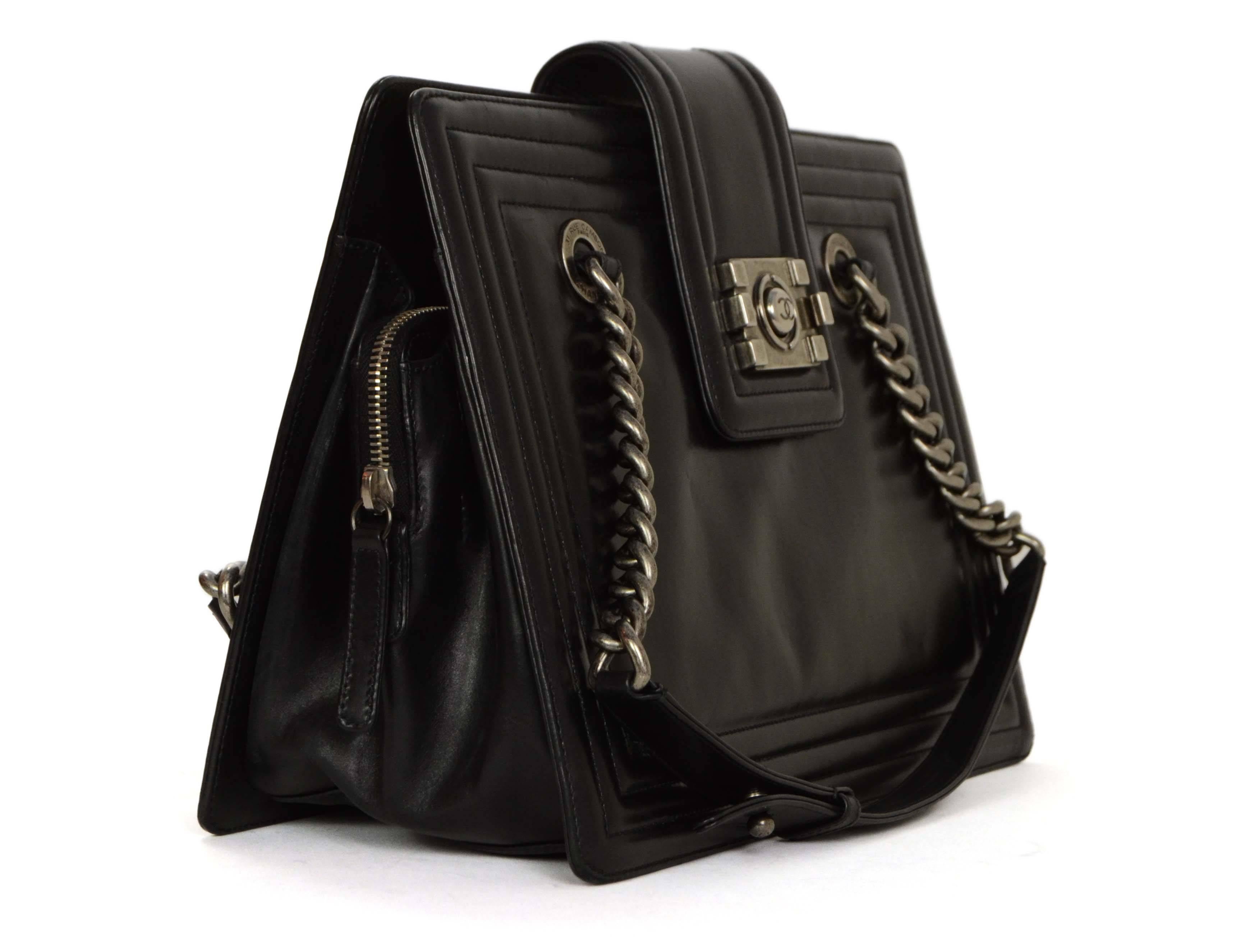 Chanel Black Polished Calfskin Boy Tote Bag

    Made In: Italy

    Year of Production: 2011

    Color: Black

    Hardware: Ruthenium

    Materials: Calfskin leather, metal

    Lining: Black fabric lining

    Closure/Opening: