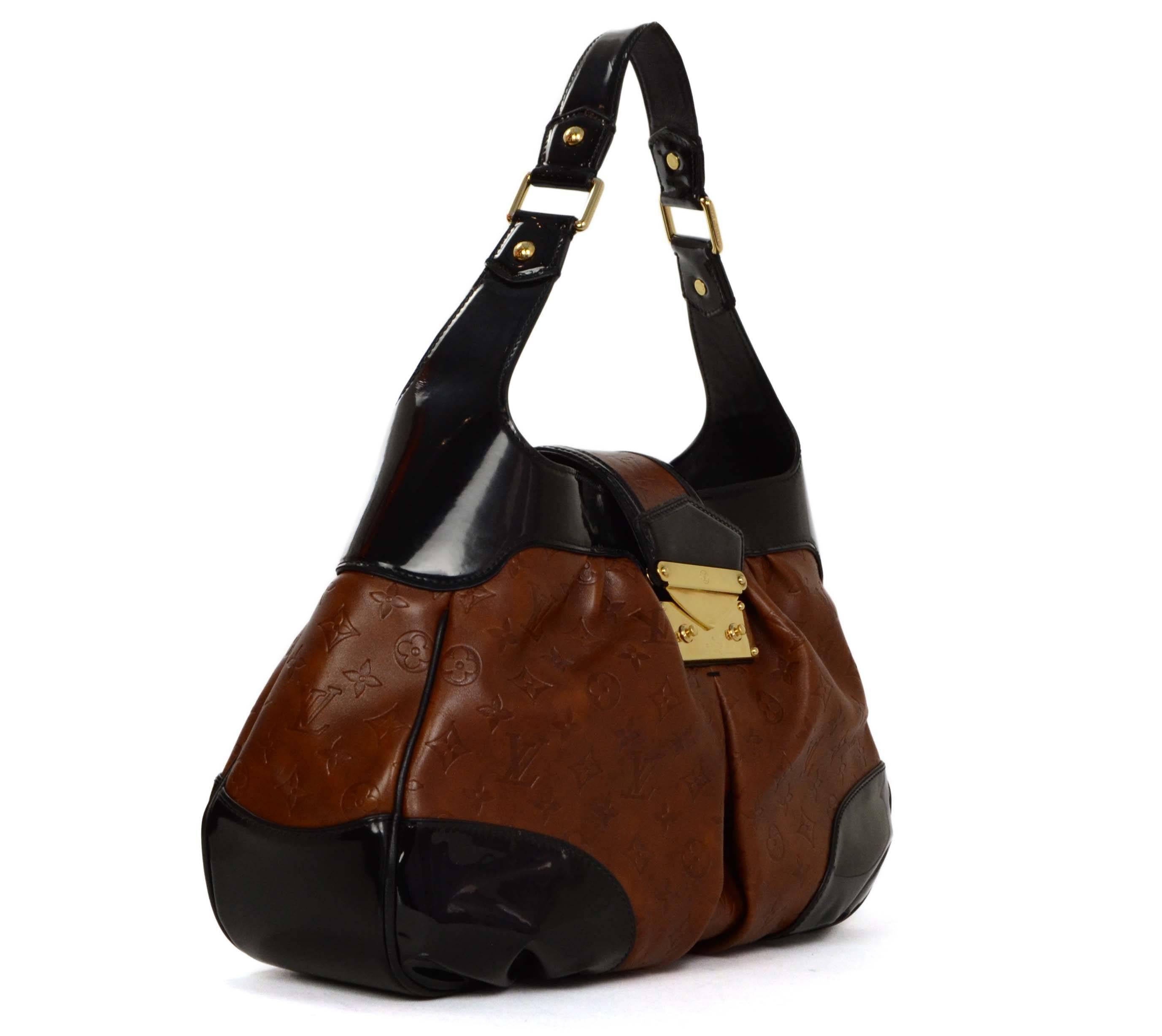Louis Vuitton Brown Empriente Leather 'Polly' Bag 
Features black patent trim and shoulder strap
Made In: France
Year of Production: 2006
Color: Brown and black
Hardware: Goldtone
Materials: Leather, patent leather and metal
Lining: Black