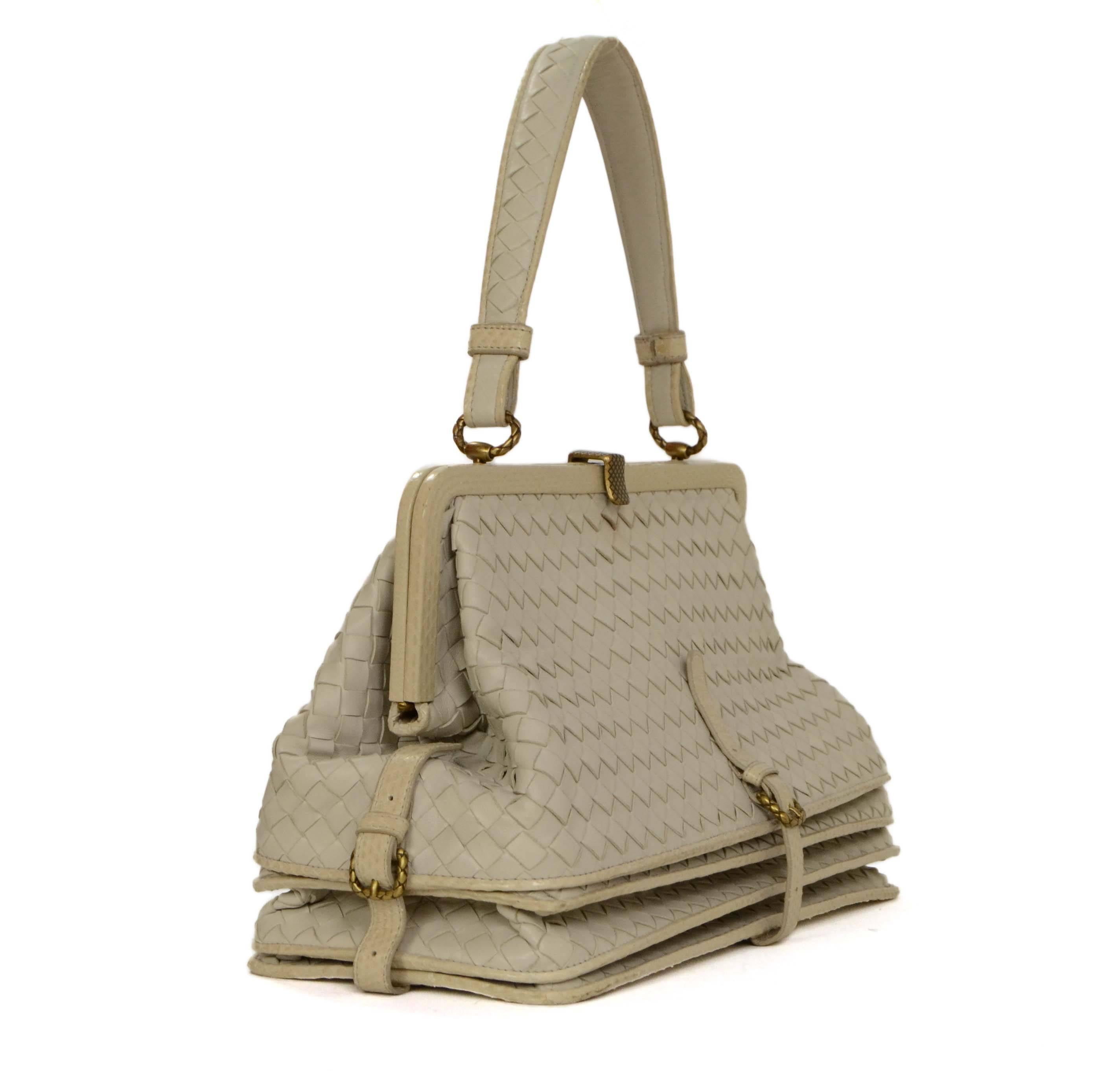Bottega Veneta Cream Woven Leather Frame Bag 
Features cream python trim 
Made In: Italy
Year of Production: 2007
Color: Cream
Hardware: Brass
Materials: Leather and python
Lining: Beige suede
Closure/Opening: Frame top opening with metal