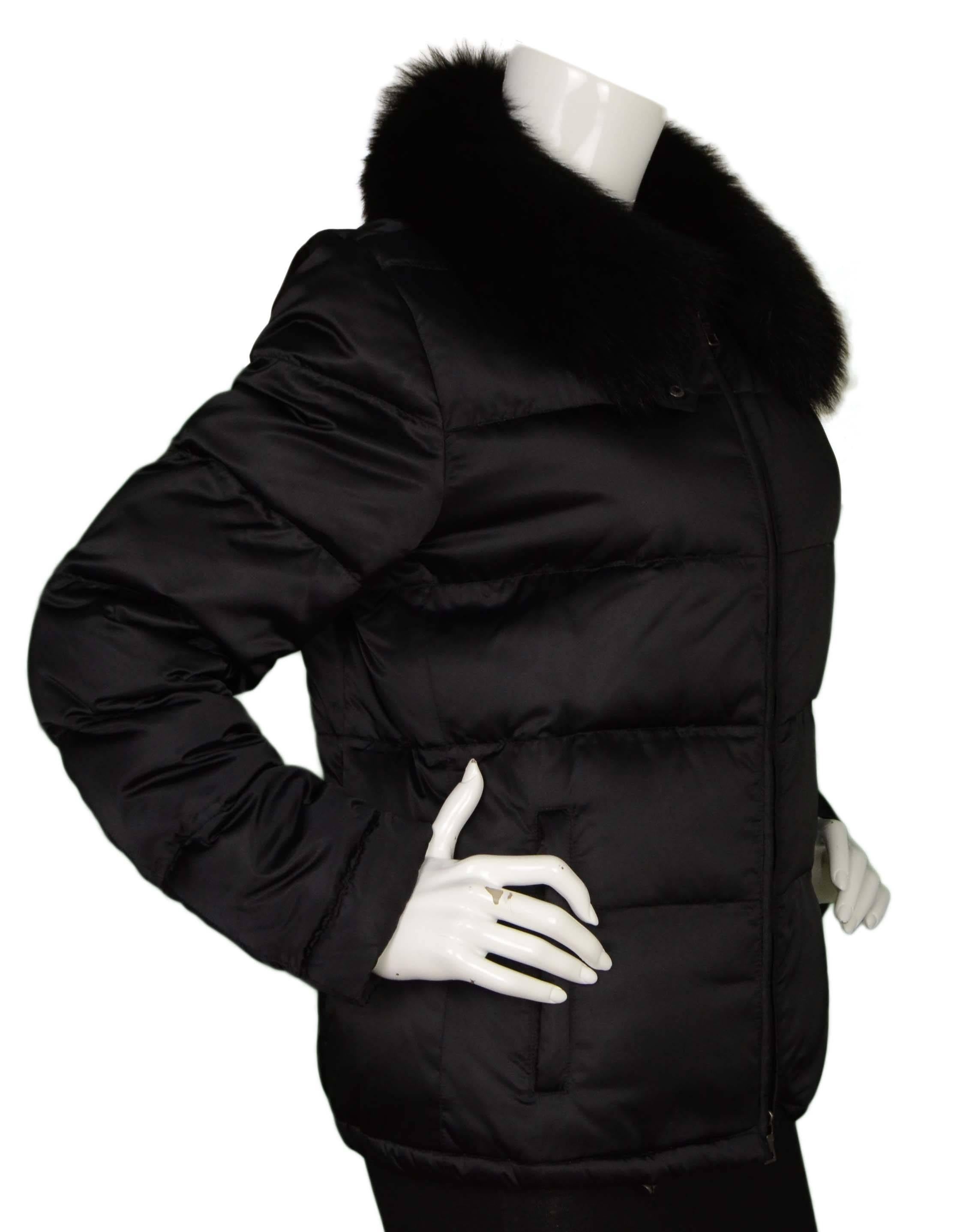 Prada Black Nylon Down Puffer Coat 
Features black raccoon removable collar
Made In: Bulgaria
Color: Black
Composition: 100% nylon, trim- 100% raccoon fur
Lining: Beige, 100% nylon
Filling: Down and white feathers
Closure/Opening: Zip up