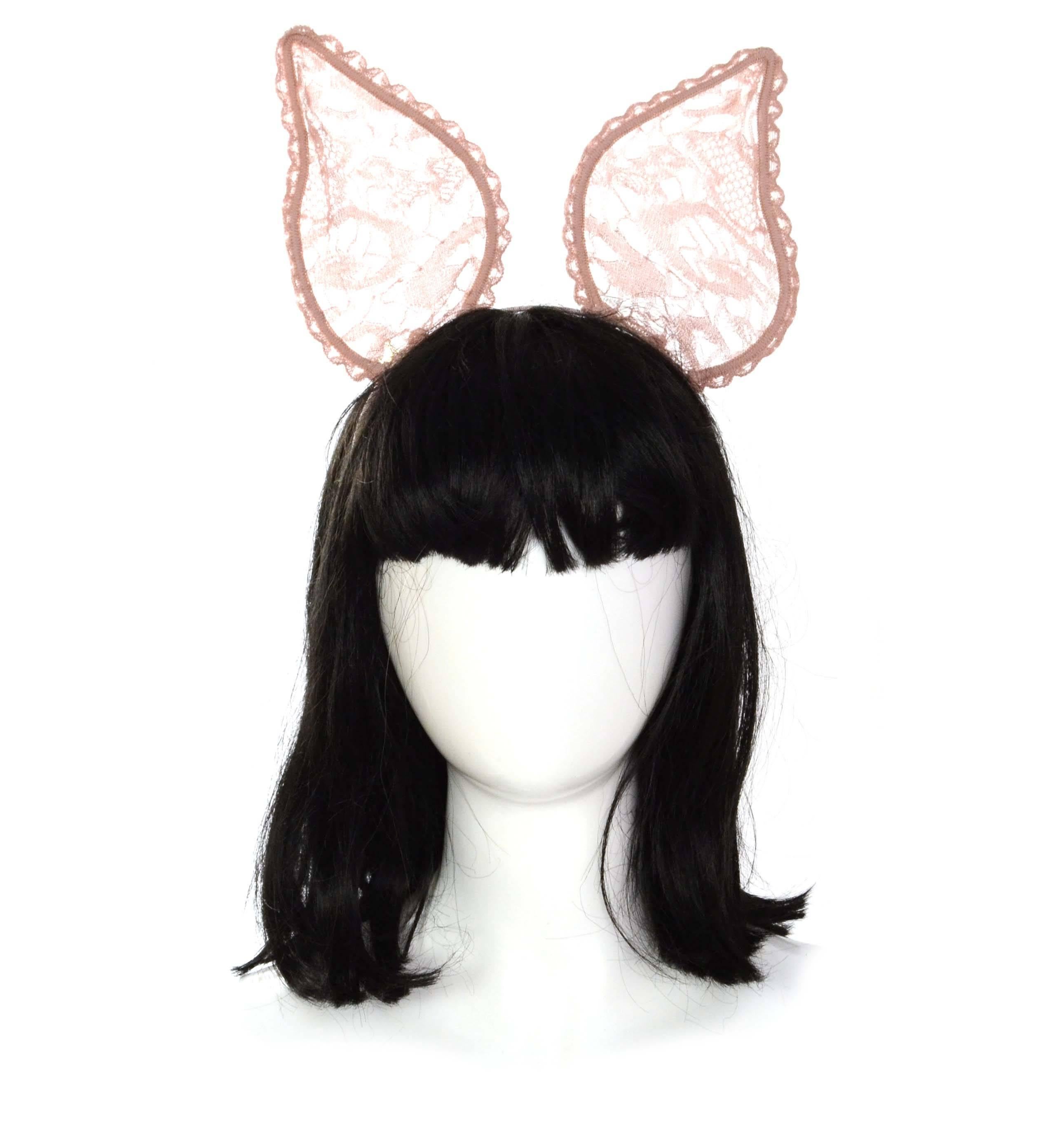 Maison Michel Nude Lace 'Heidi' Bunny Ear Headband 
Features small silvertone and crystal M on one ear
Made In: France
Color: Dusty pink/nude
Composition: Lace, wire, and grosgrain
Overall Condition: Excellent- tag still attached
Retail: