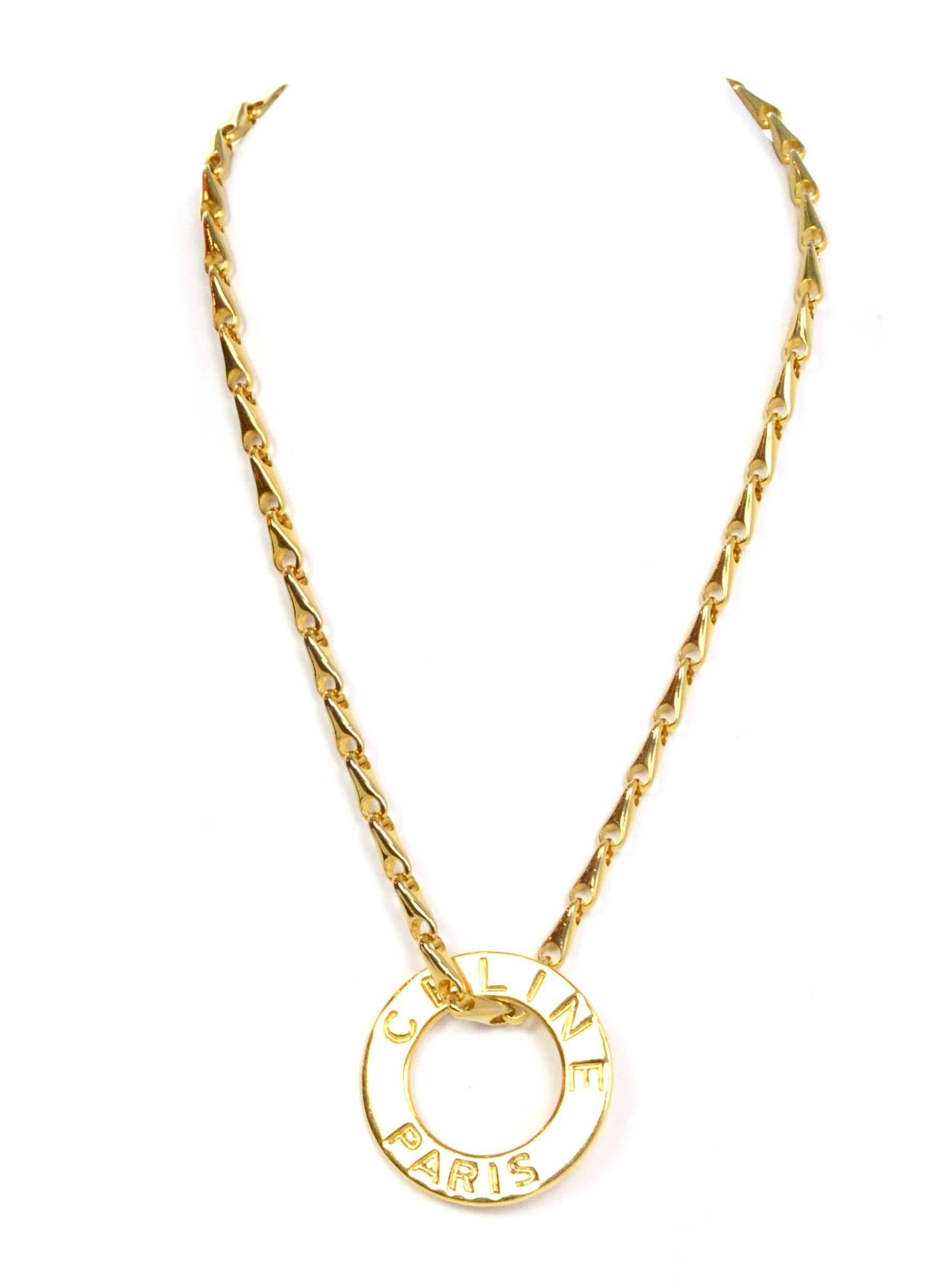 Celine Gold Double Chain Link Necklace 
Features versatility as it can be worn with one or two chains and chains can be connected to make one long strand necklace
Color: Goldtone
Materials: Metal
Closure: Lobster claw clasps
Stamp: Celine