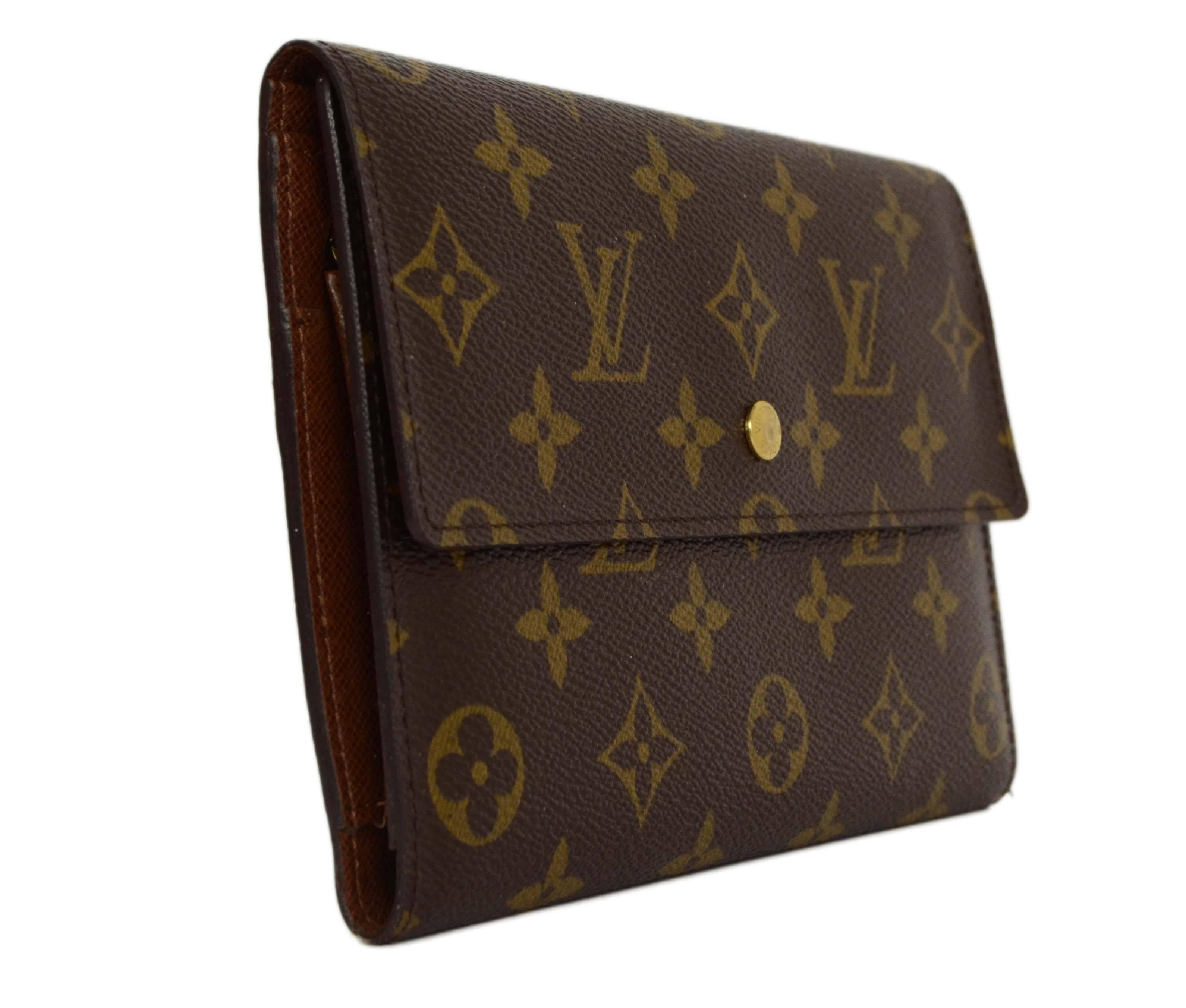 Louis Vuitton Monogram Canvas XL Snap Wallet 
Made In: Spain
Year of Production: 2006
Color: Brown
Hardware: Goldtone
Materials: Coated canvas
Lining: Brown coated canvas
Closure/Opening: Flap top with snap closure
Exterior Pockets: