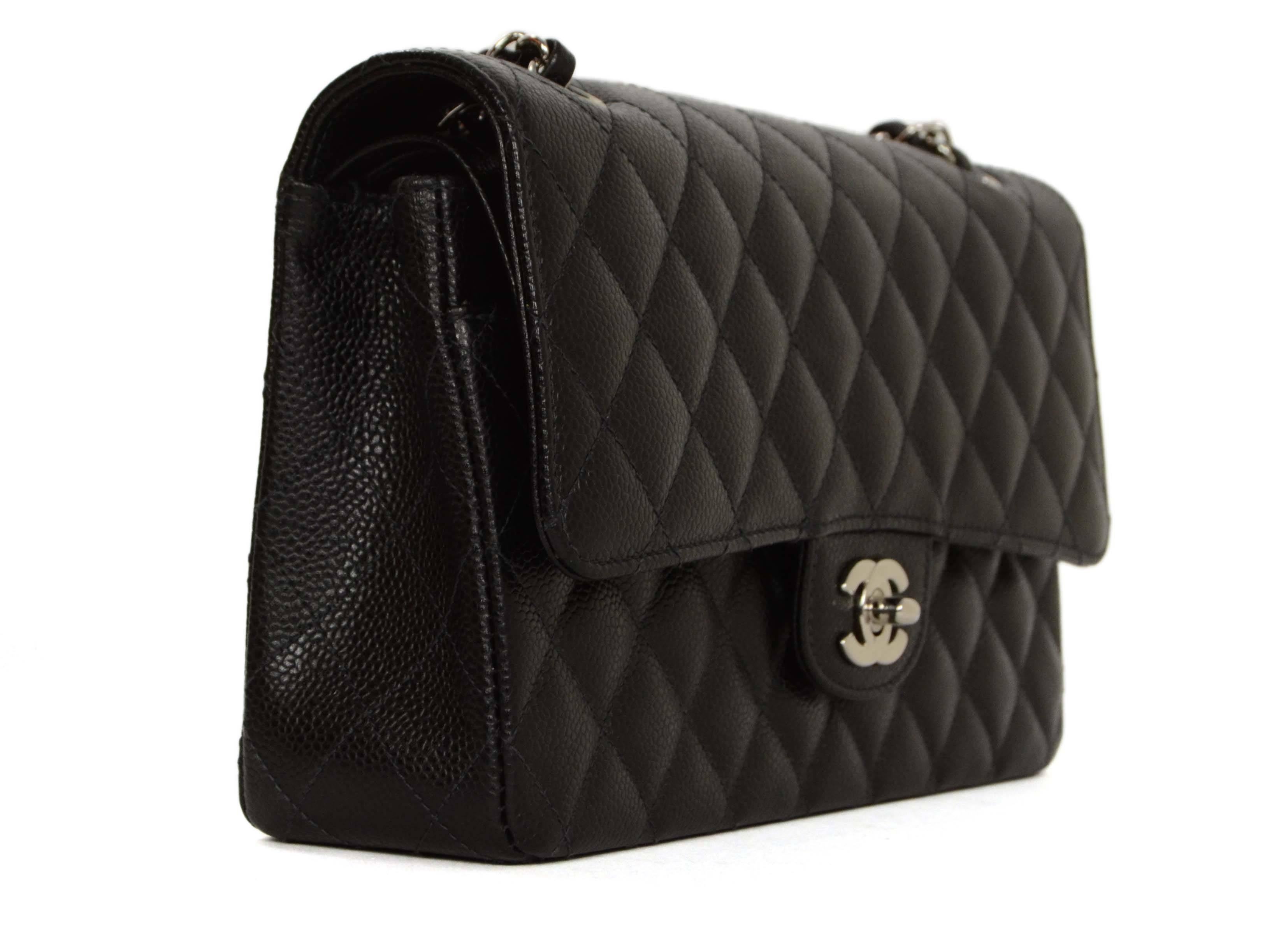 Chanel Black Quilted Caviar Double Flap Medium Classic Bag
Features adjustable chain that can be would doubled  on the shoulder or singled.

    Made In: France

    Year of Production: 2005

    Color: Black

    Hardware: Silver

   