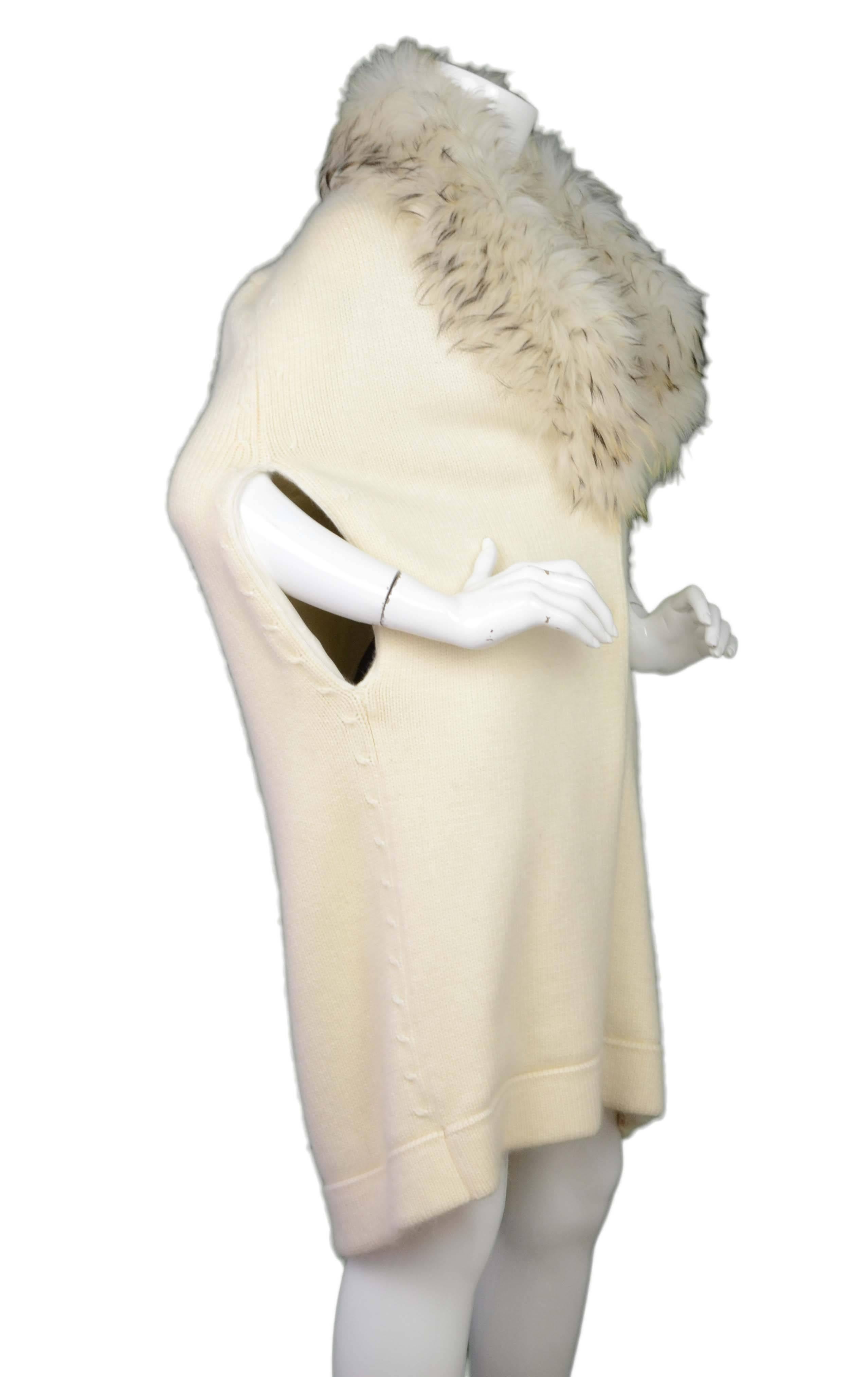 Roberto Cavalli Cream Knit & Fur Collar Cape 
Features removable fur collar
Made In: Italy
Color: Cream
Composition: Collar- 100% fur, Cape- 40% viscose, 20% wool, 18% mohair, 14% nylon
Lining: Cream, 92% cupro, 8% elastane
Closure/Opening: