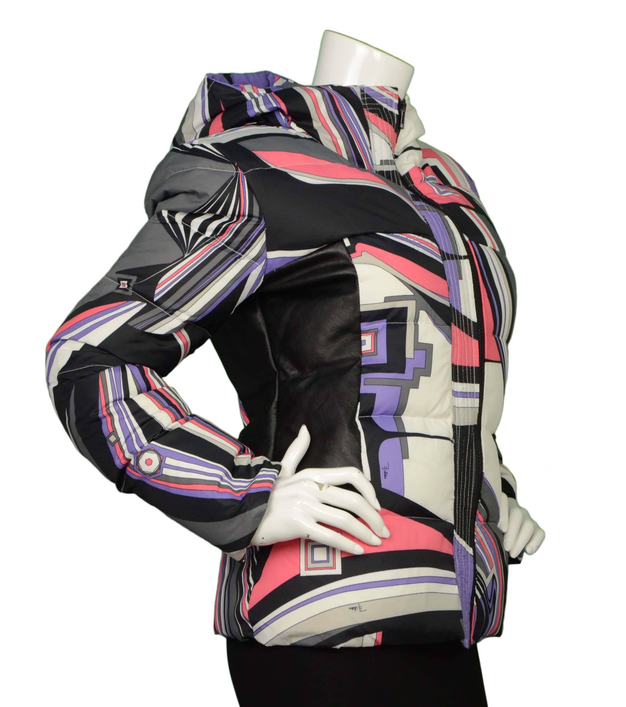 Emilio Pucci Multi-Colored Geometric Down Coat 
Features hood and black leather panels on sides 
Made In: Italy
Color: Purple, pink, grey, white and black
Composition: 100% nylon
Lining: Light grey and Geometric print, 100%