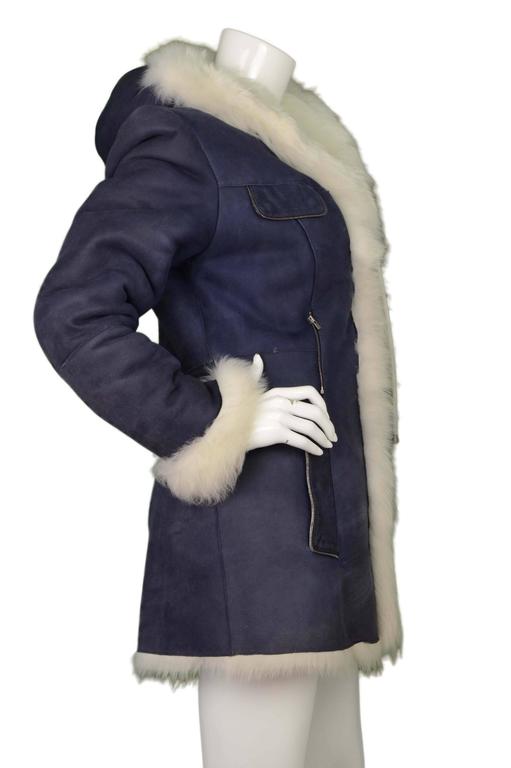 blue coat with white fur hood