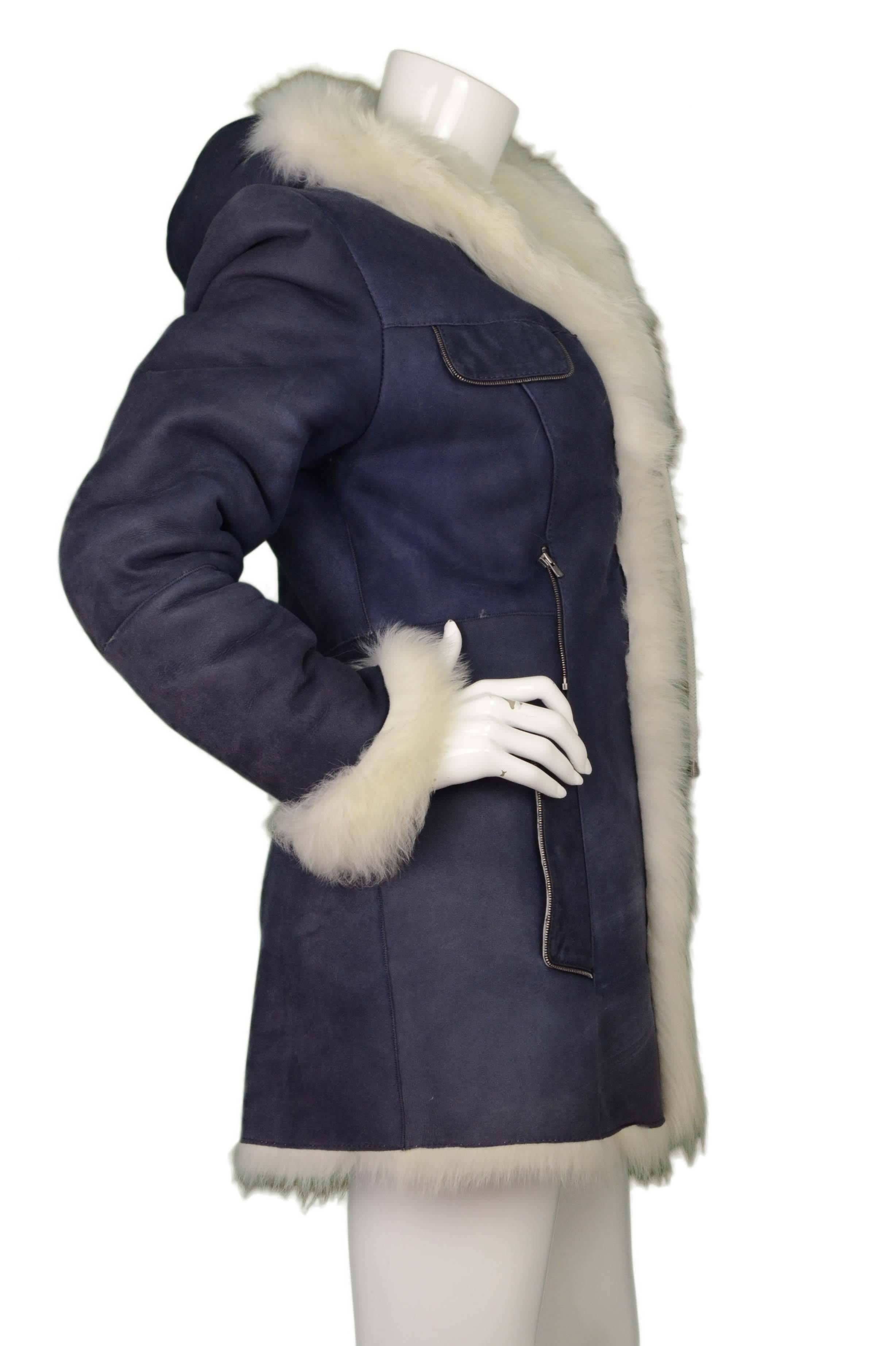 Armando Diaz Purple Suede & White Fur Coat 
Features white fur trim, lining and hood
Made In: Turkey
Color: Purple/blue and white
Composition: Not given- believed to be 100% suede and 100% fur
Lining: White, fur
Closure/Opening: Button down