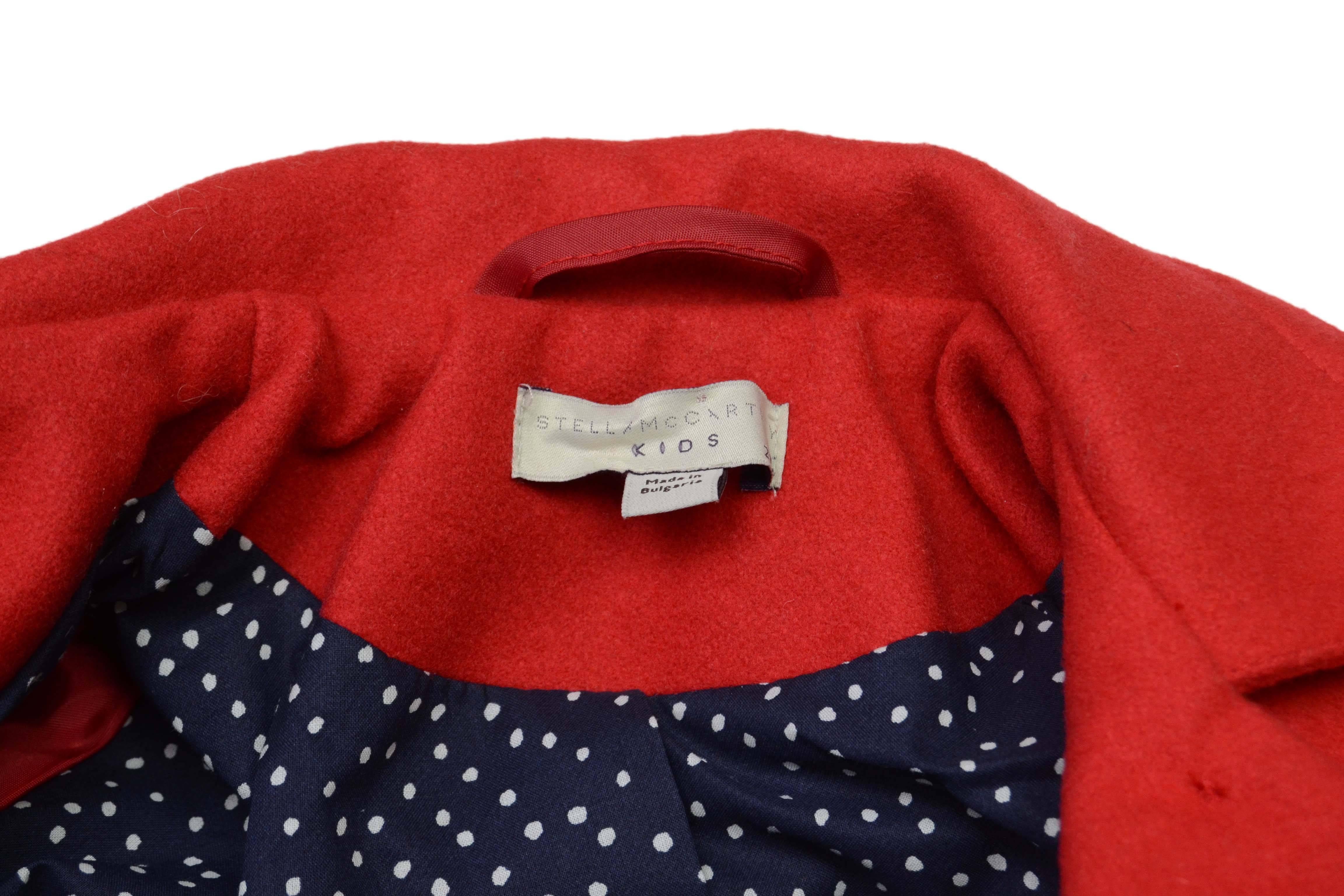 Stella McCartney KIDS Red Wool Coat Year 2 
Features navy and white polka dot printed lining
Made In: Bulgaria
Year of Production: 2012
Color: Red 
Composition: 80% wool, 20% polyamide
Lining: Navy and white polka dot, 100%