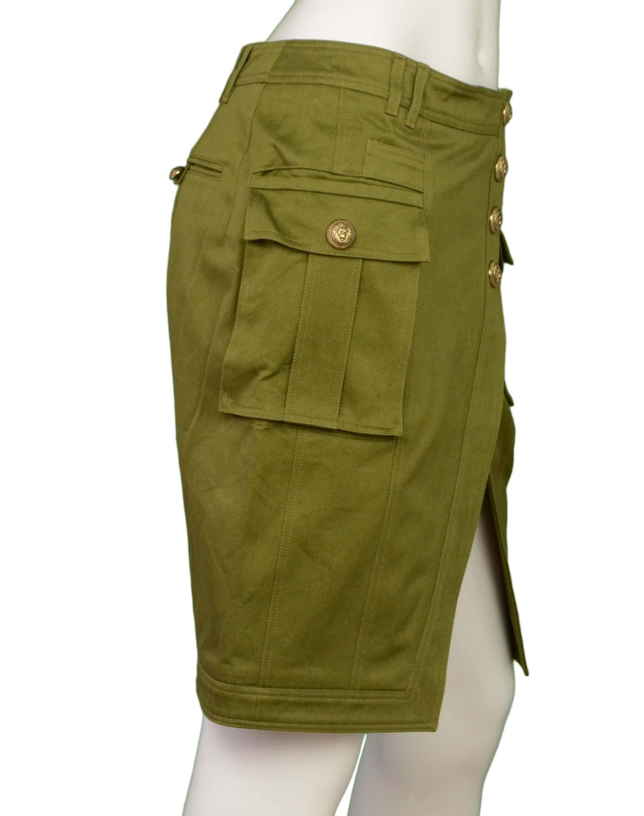 Balmain Olive Green Cotton Cargo Skirt 
Features large gold buttons with lion's head detailing
Made In: European Union
Color: Olive green
Composition: 100% cotton
Lining: None
Closure/Opening: Back center zipper
Exterior Pockets: Two cargo