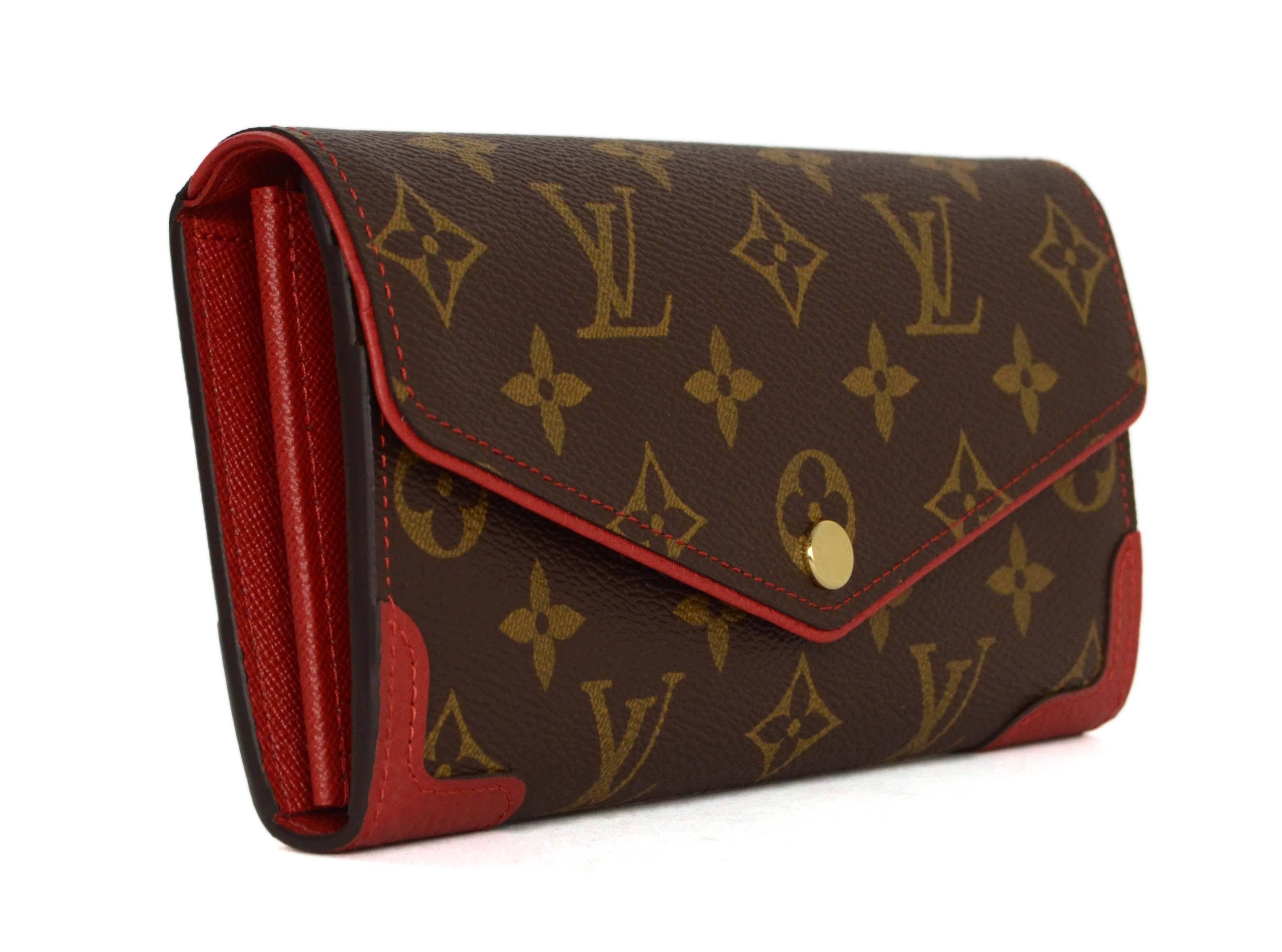 Louis Vuitton Monogram Sara Retiro Wallet
Features red leather trim

    Made In: France

    Year of Production: 2015

    Color: Monogram, red

    Hardware: Gold

    Materials: Coated canvas, leather

    Lining: Red leather