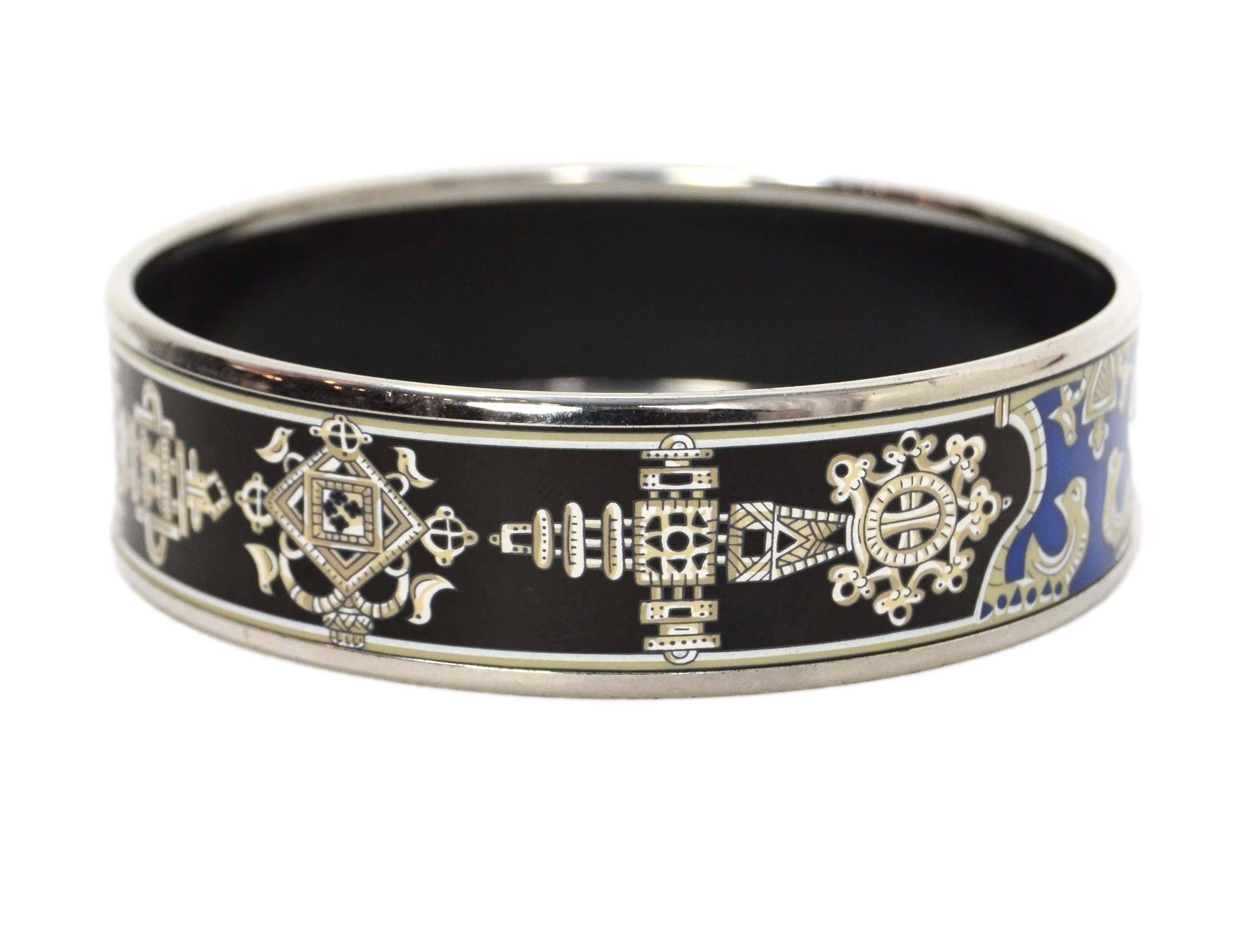 Hermes Baroque Printed Enamel Wide Bangle 
Features palladium framing enamel
Made In: Austria
Color: Black, blue, white, taupe and silvertone
Materials: Palladium and enamel
Closure: None
Stamp: Hermes Paris Made in Austria + L
Overall