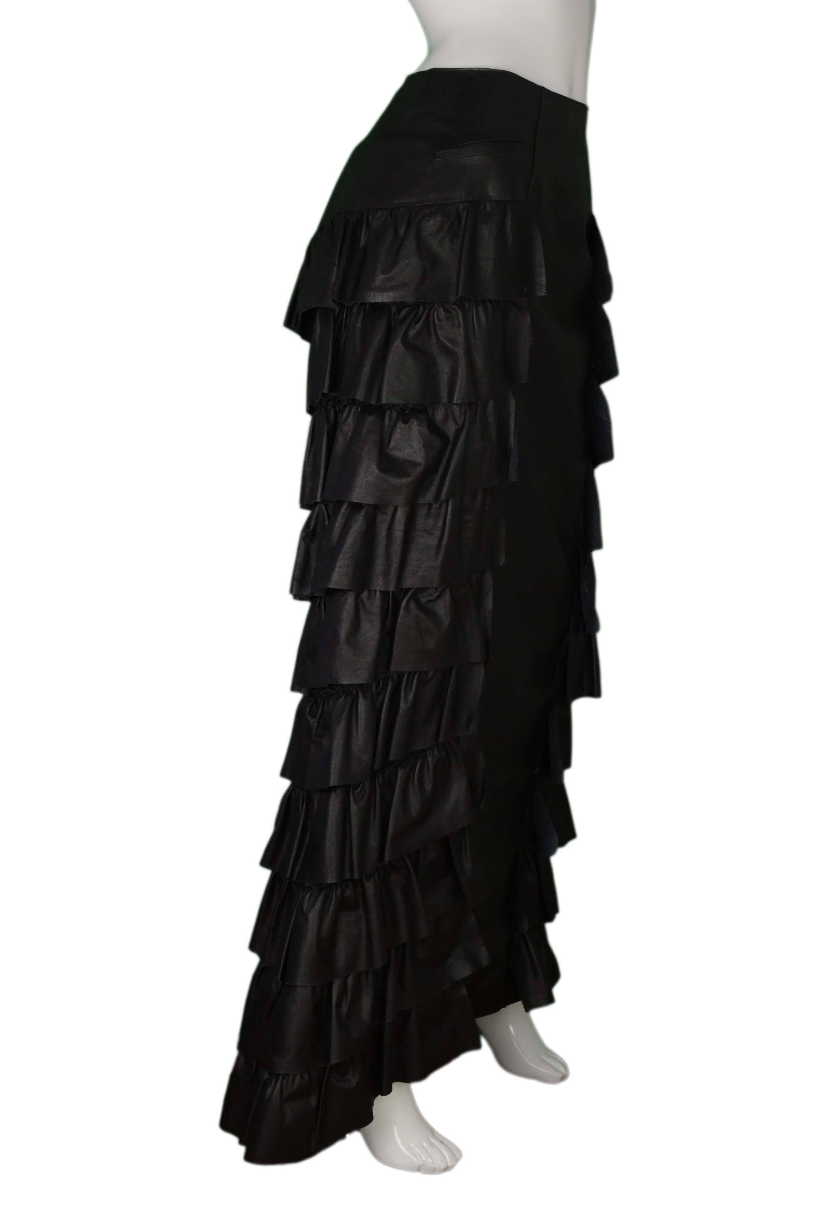 Chanel Black Leather Ruffle Floor Length Skirt 
Made In: France
Year of Production: 2001
Color: Black
Composition: 100% calfskin
Lining: Double lining- 100% silk, and 100% nylon
Closure/Opening: Back zip up with hook and eye closure
Exterior