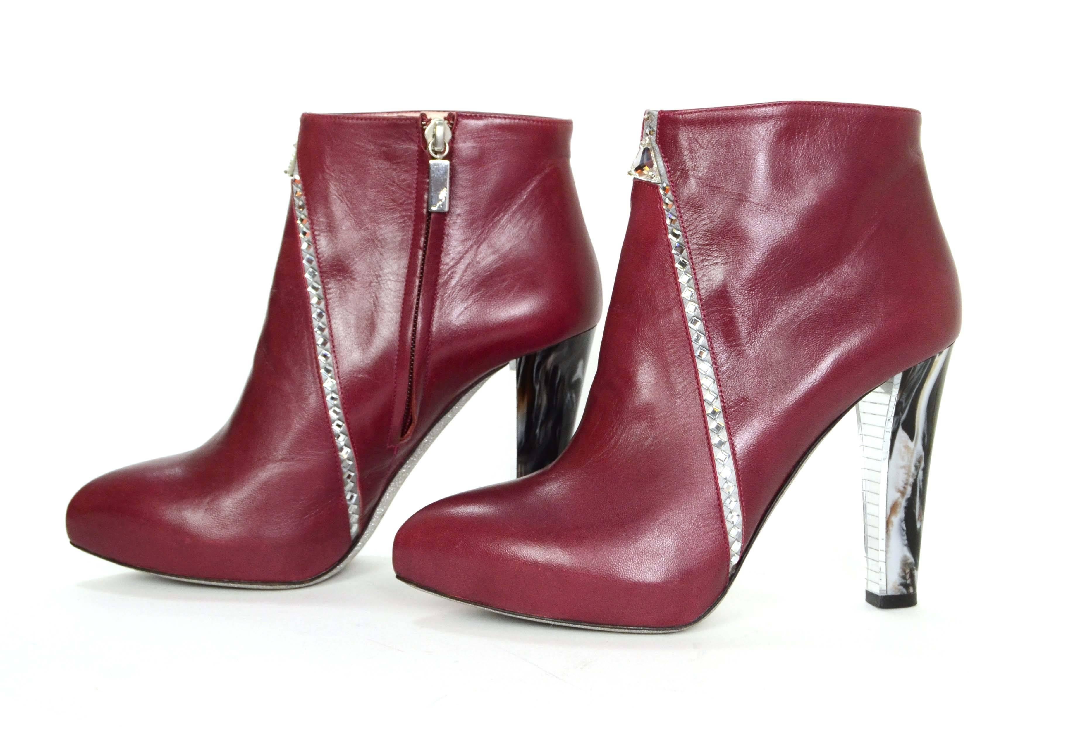 Rene Caovilla Crystal Embellished Burgundy Leather Booties 
Features marble heel and glitter soles
Made In: Italy
Color: Burgundy black and silver
Composition: Leather, resin, and crystal
Closure/Opening: Inside ankle zipper
Sole Stamp: Rene