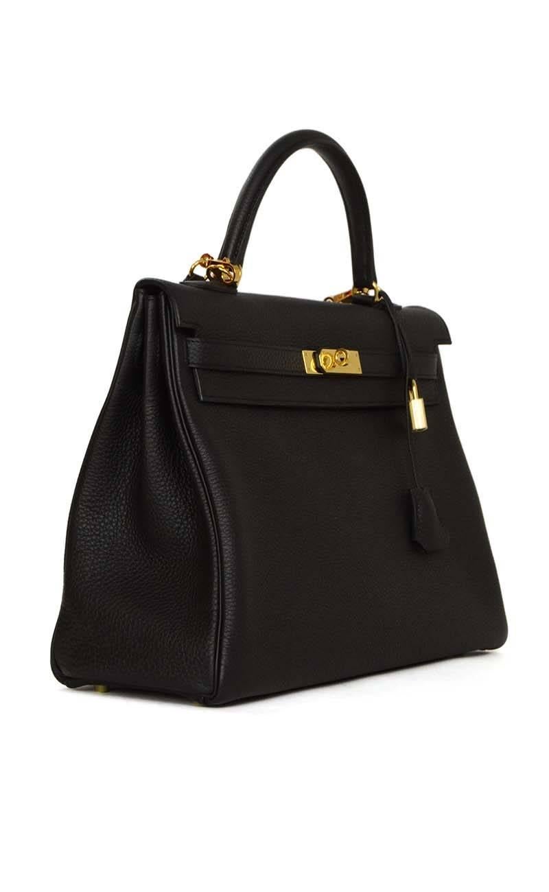 Hermes Black Togo Leather 35cm Kelly Bag 
Features optional shoulder strap
Made in: France
Year of Production: 2014
Color: Black
Hardware: Goldtone
Materials: Togo leather
Lining: Black Leather
Closure/Opening: Two leather arms and center