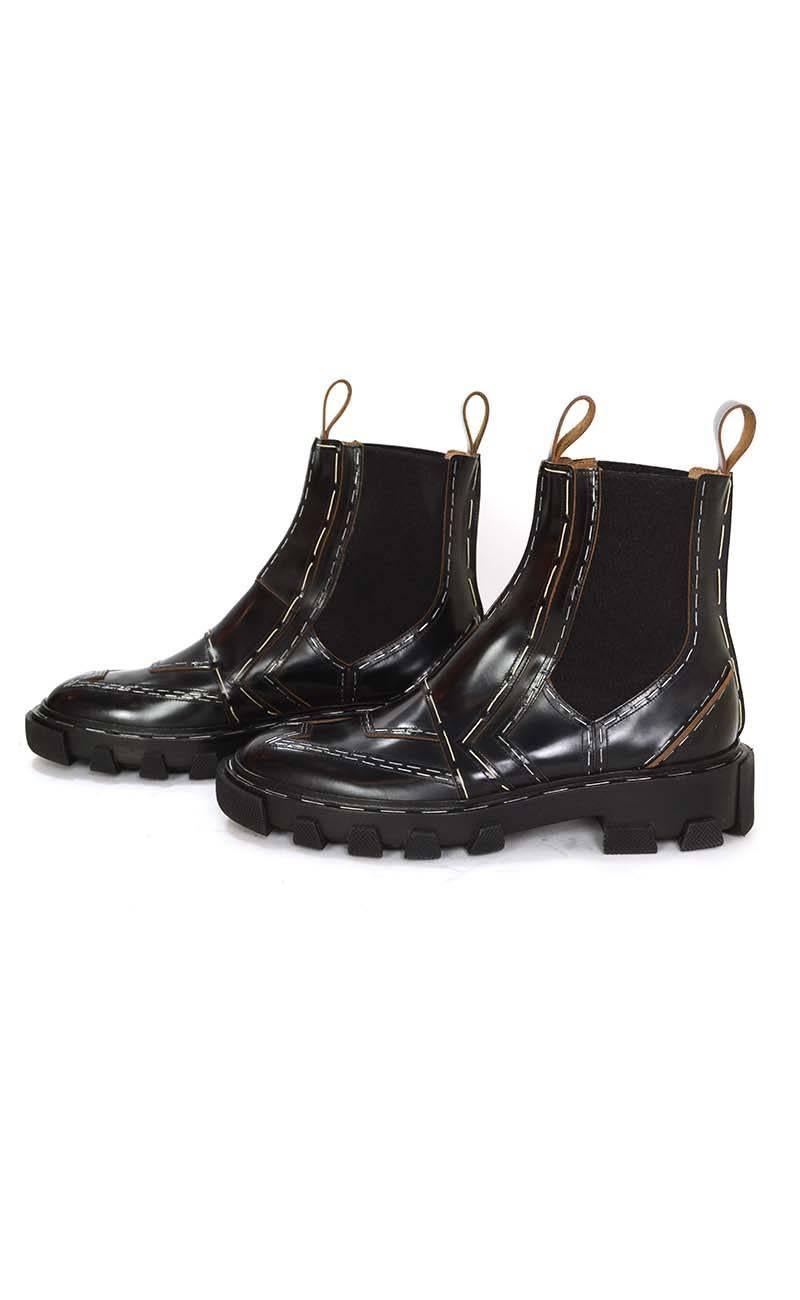 Balenciaga Black Stapled Leather Chelsea Boots 
Features staples and stitching design throughout exterior
Made In: Italy
Color: Black
Materials: Leather
Closure/Opening: Pull on
Sole Stamp: Balenciaga 38 Made in Italy
Retail Price: $1,485 +