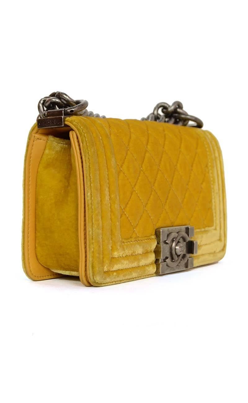 Chanel Yellow Velvet Small Boy Bag
Features shoulder strap that can be worn doubled, or singled as a crossbody.  
Made In: Italy
Year of Production: 2012
Color: Yellow
Hardware: Antiqued silvertone
Materials: Velvet with leather and