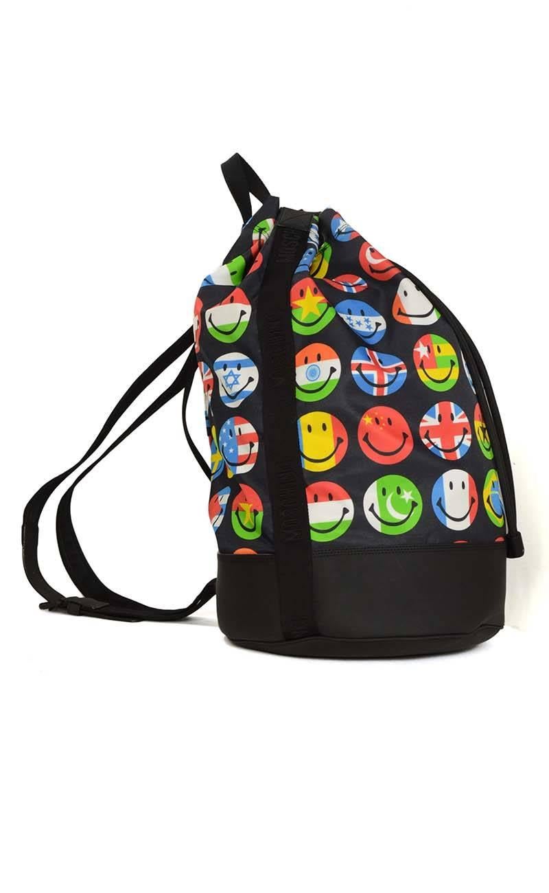 Moschino Flag & Smiley Print Nylon Drawstring Backpack 
Features different colored smiley faces printed with different countries flags throughout
Made In: Italy
Color: Black and multi-colored
Hardware: Black rubber
Materials: Nylon, rubber and