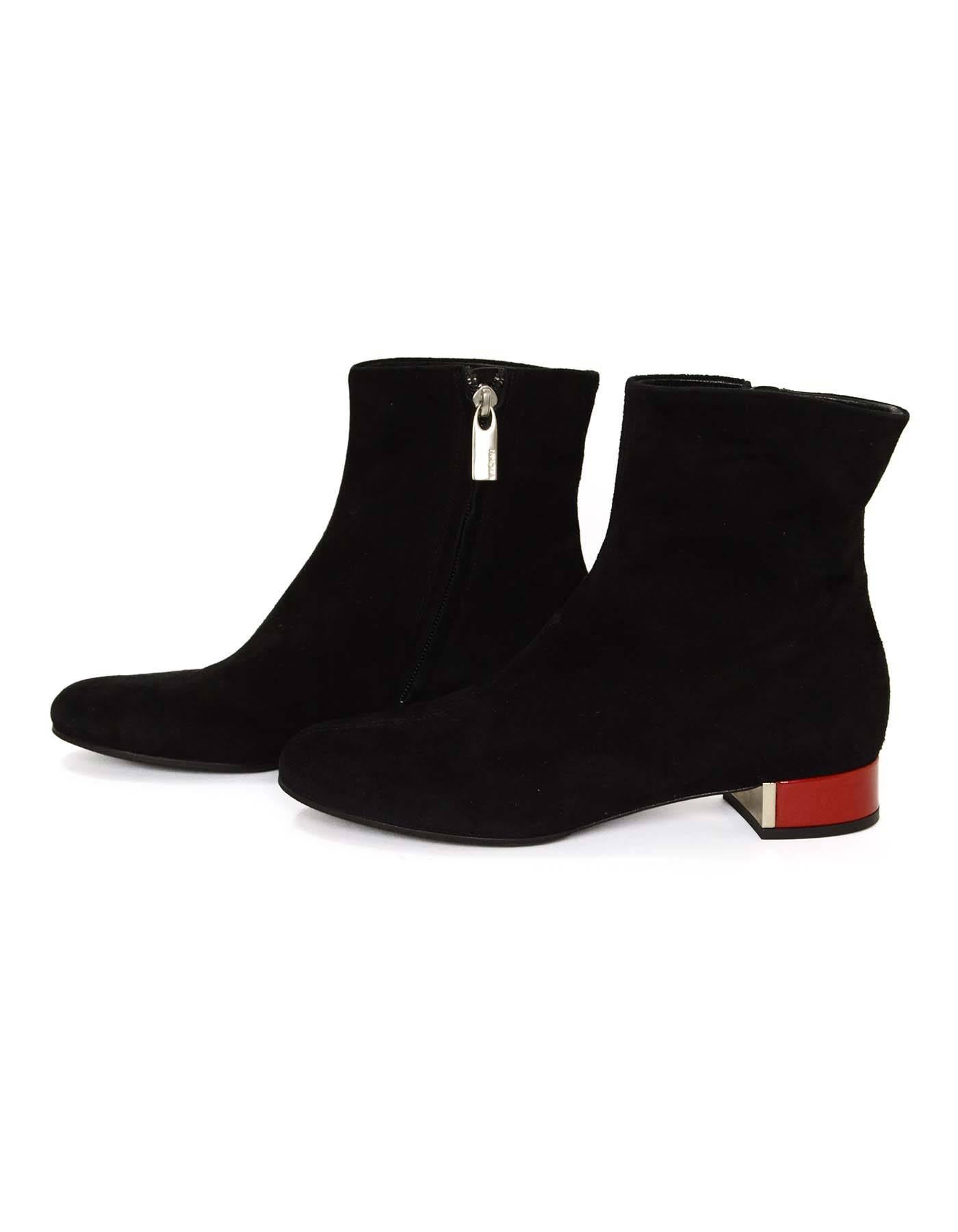 Vicini Black Suede Ankle Boots 
Features red patent and silver metal heel
Made In: Italy
Color: Black
Materials: Suede
Closure/Opening: Inner ankle zip up
Sole Stamp: Vicini Vero Cuoio Made in Italy 36
Overall Condition: Excellent pre-owned