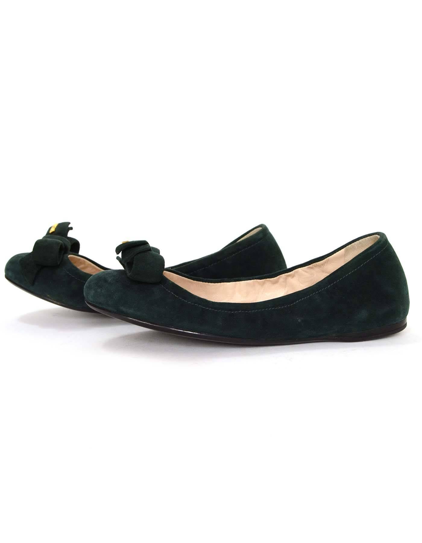 Prada Green Suede Ballet Flats 
Features large suede bow at toe with Prada in goldtone metal
Made In: Vietnam
Color: Green
Materials: Suede
Closure/Opening: Slide on with elastic opening
Sole Stamp: Prada
Overall Condition: Excellent