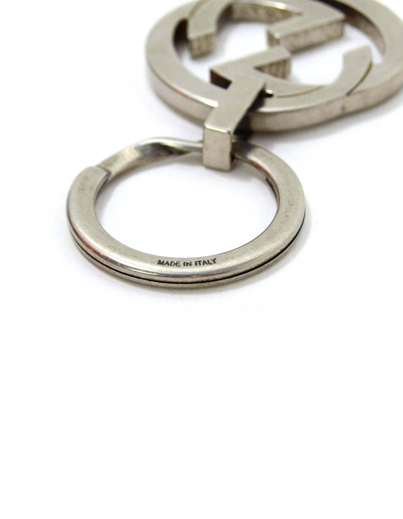 Gucci Silver Logo Key Ring
Made In: Italy
Color: Antique silvertone/gunmetal grey
Materials: Metal
Closure/Opening: Split key ring opening
Stamp: Gucci Made in Italy
Overall Condition: Excellent pre-owned condition
Includes: Gucci