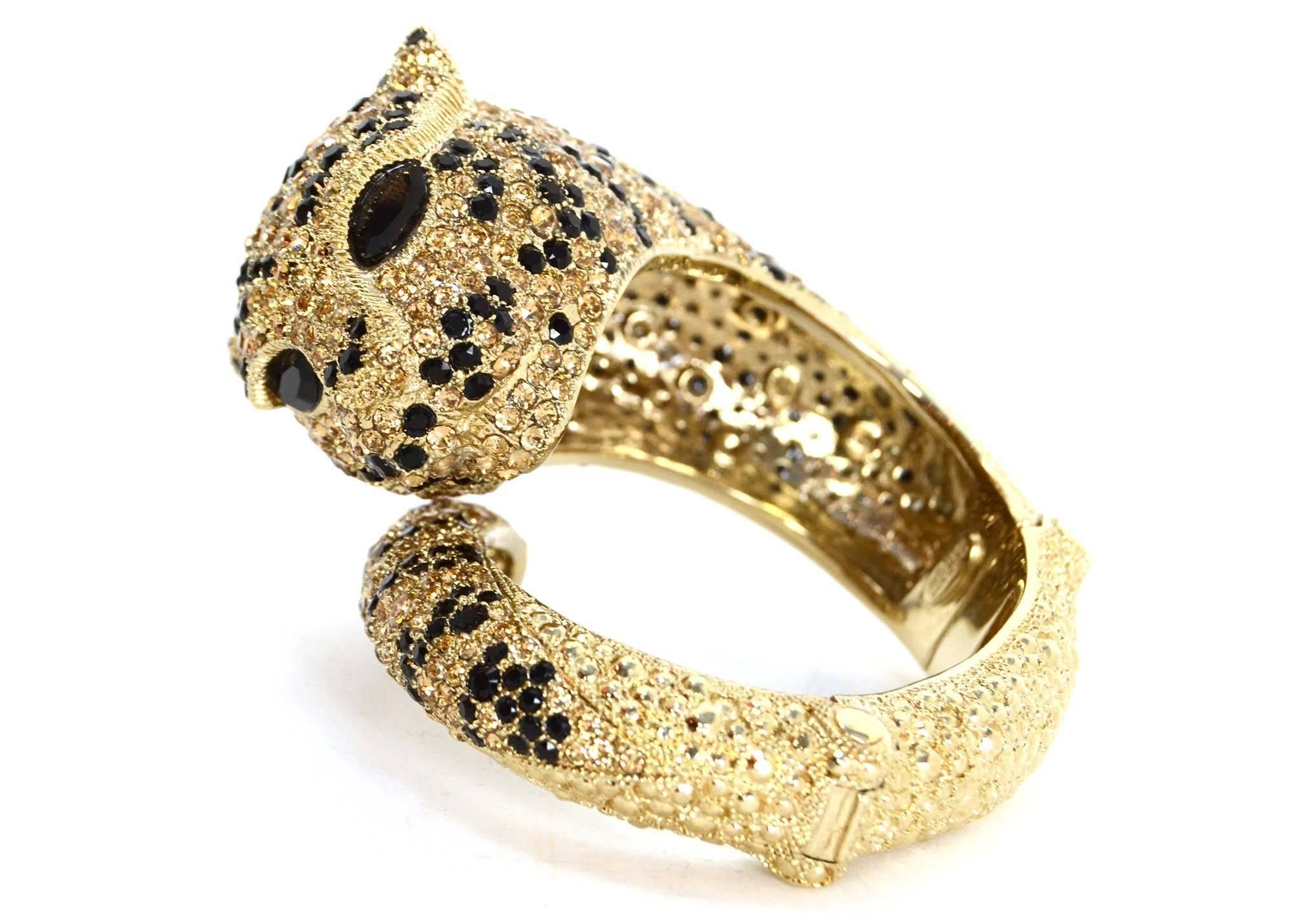 Roberto Cavalli Gold & Swarovski Crystal Panther Bracelet
Gradually gets wider and features face and tail of panther

    Made in: Italy
    Stamp: Roberto Cavalli Made in Italy
    Closure: Hinge opening
    Color: Goldtone, black and