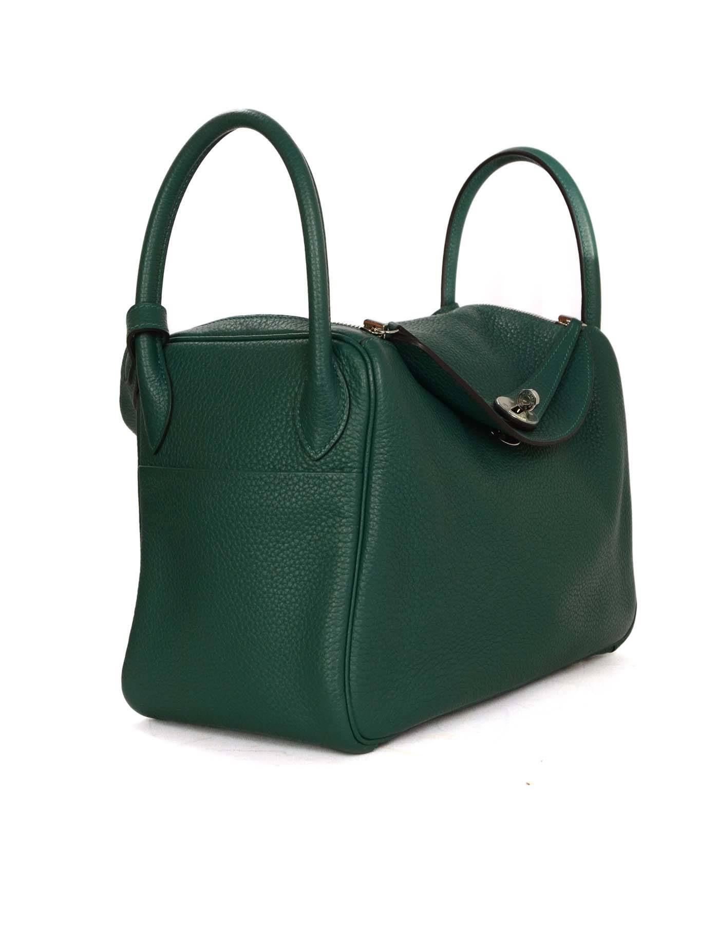 Hermes Malachite Green Clemence 30cm Lindy Bag 

-Made In: France
-Year of Production: 2014
-Color: Malachite green
-Hardware: Palladium
-Materials: Clemence leather
-Lining: Malachite leather
-Closure/Opening: Double sided zip closure with