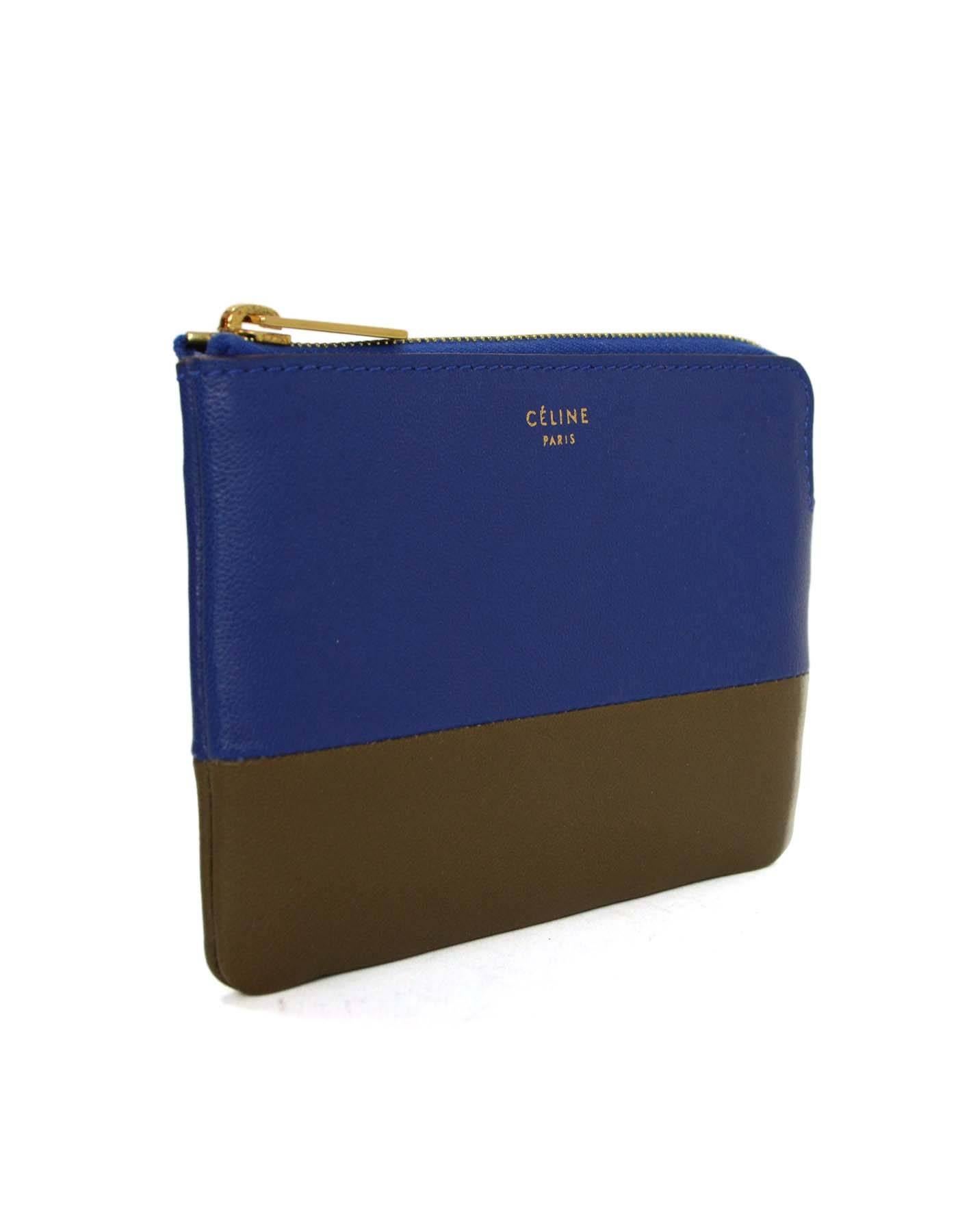 Celine Blue & Taupe Leather Coin Purse 
Made In: Italy
Color: Blue and taupe
Hardware: Goldtone
Materials: Leather
Closure/Opening: Zip across top
Exterior Pockets: None
Interior Pockets: None
Overall Condition: Exellent pre-owned