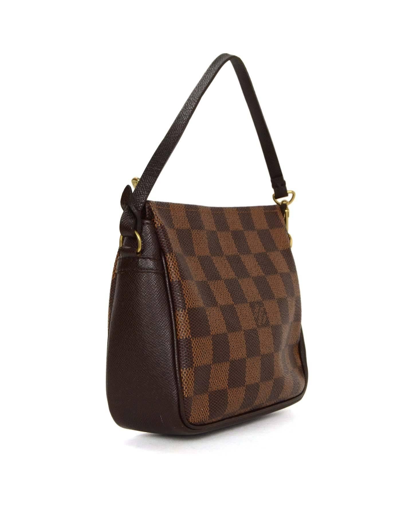 Louis Vuitton Vintage '98 Damier Trousse Square Pochette 
Features optional strap
Made In: France
Year of Production: 1998
Color: Brown
Hardware: Goldtone
Materials: Coated canvas
Lining: Brick red canvas
Closure/Opening: Zip across