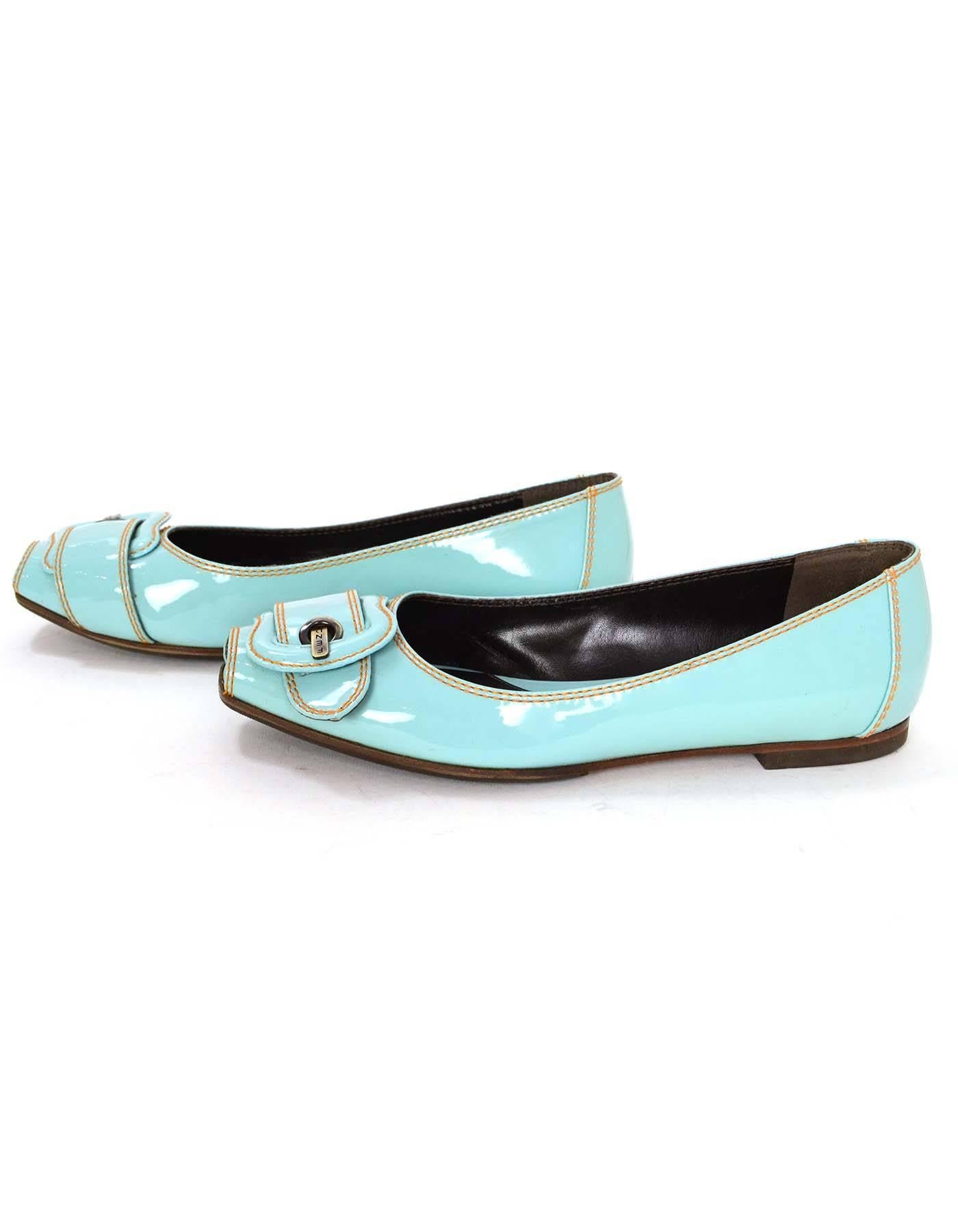 Fendi Light Blue Patent Peep-Toe Flats 
Features Fendi buckle at toe 
Made In: Italy
Color: Light blue
Materials: Patent leather
Closure/Opening: None
Sole Stamp: Fendi Made in Italy Vero Cuoio 37 1/2
Overall Condition: Excellent pre-owned