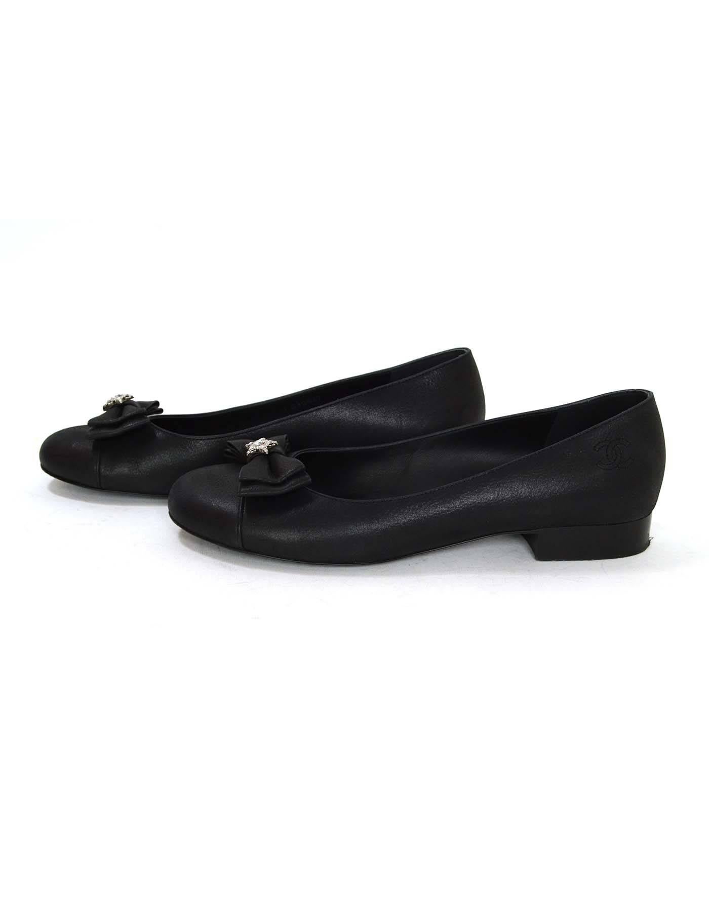 Chanel Black Iridescent Calfskin Flats 
Features bow with crystal star at toe
Made In: Italy
Color: Iridescent black
Materials: Calfskin
Closure/Opening: Slide on
Sole Stamp: CC Made In Italy 38
Retail Price: $825 + tax
Overall Condition: