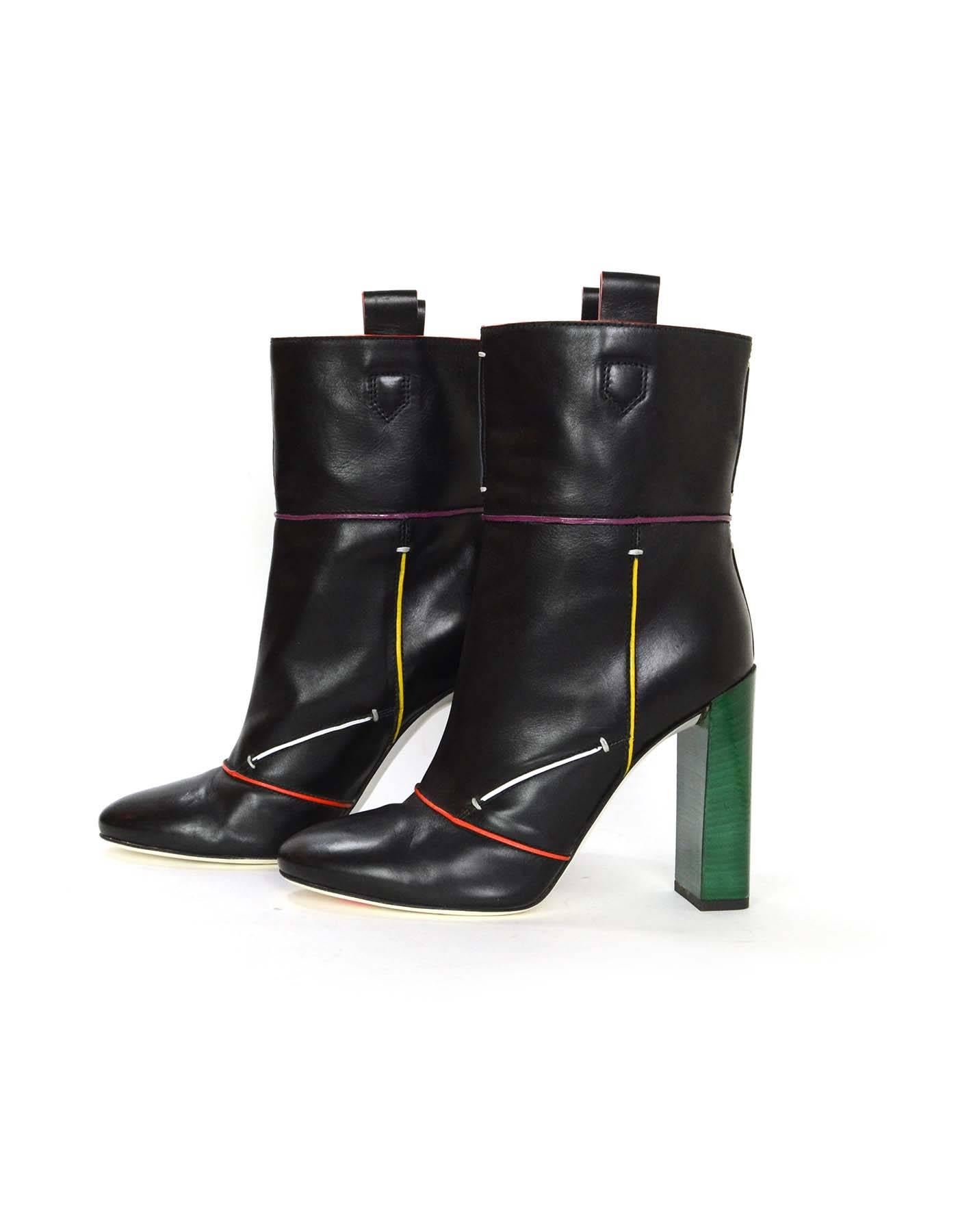 Fendi Black Leather Subway Boots 
Features multi-colored piping throughout with a green stacked heel
Made In: Italy
Color: Black, red, purple, yellow, white and green
Materials: Leather
Closure/Opening: Pull on
Sole Stamp: Fendi Made In Italy