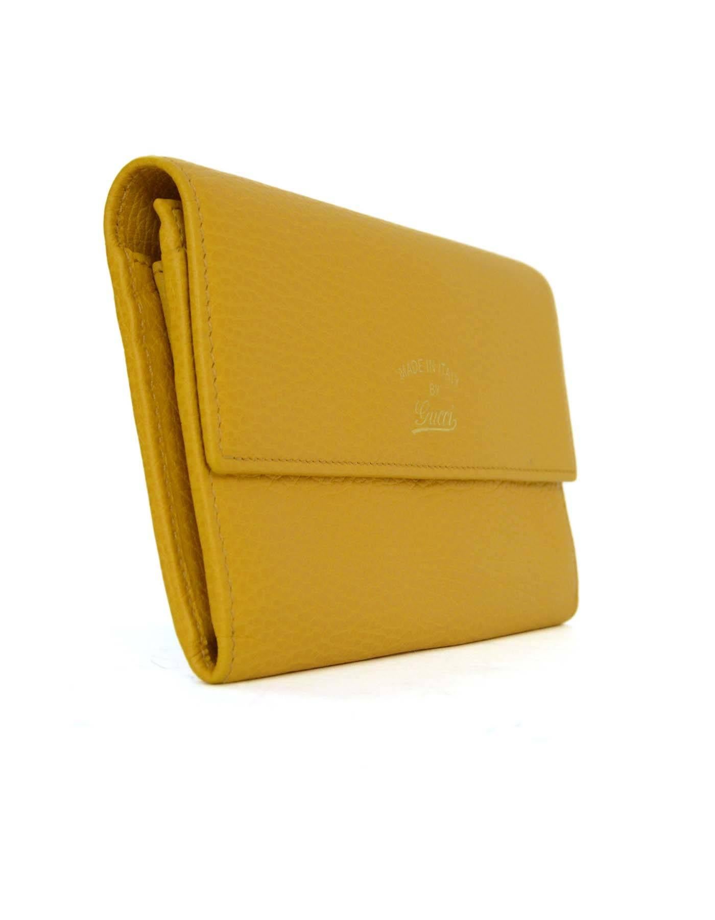 Gucci Yellow Swing Leather Continental Flap Wallet 
Features 'Made in Italy by Gucci' stamped on flap top in gold
Made In: Italy
Color: Yellow
Hardware: Goldtone
Materials: Leather
Lining: Yellow leather
Closure/Opening: Flap top with snap