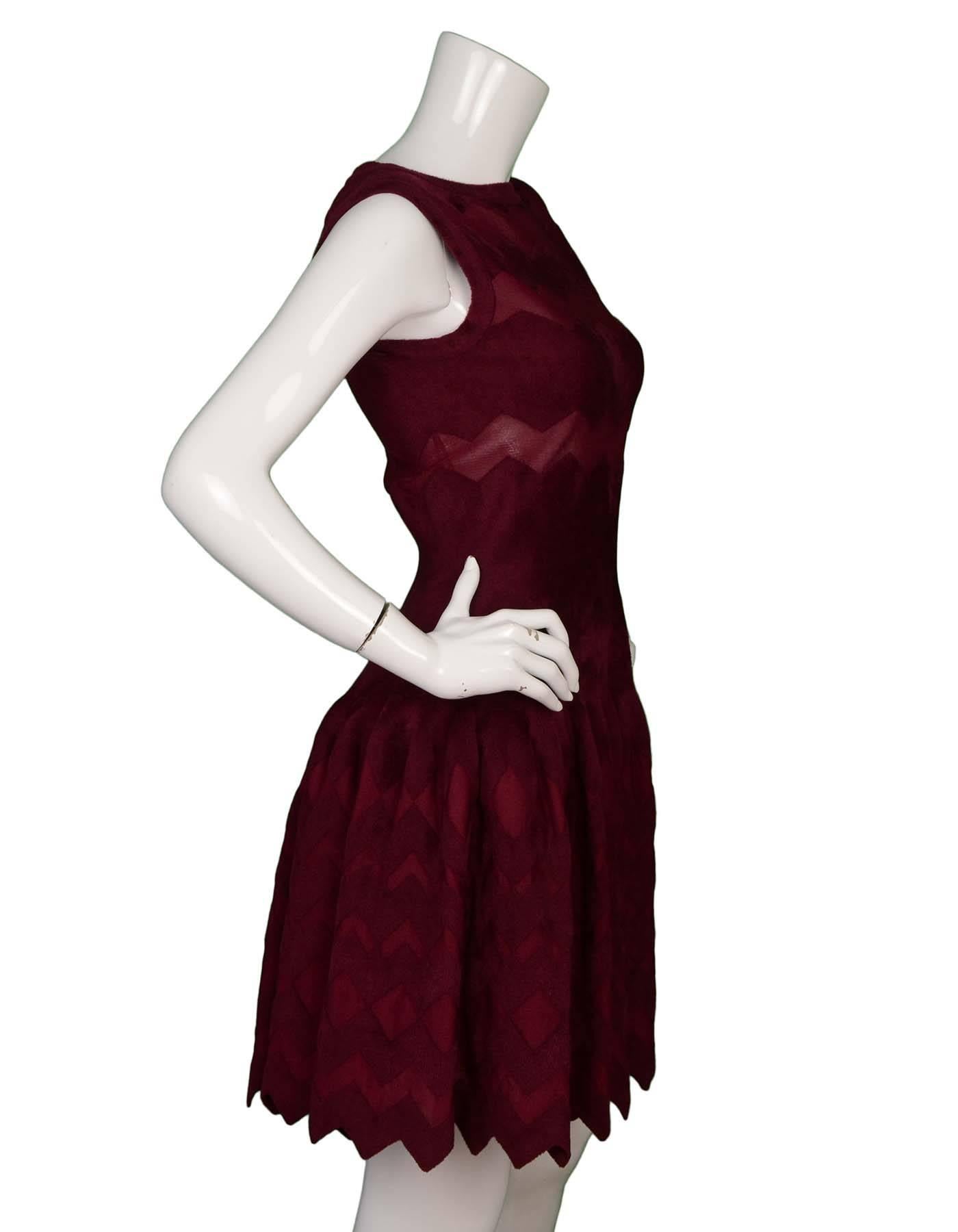 Alaia Burgundy Fit Flare Sleeveless Dress 
Features zig zag mesh cut-out detailing throughout
Made In: Italy
Color: Burgundy
Composition: 40% silk, 35% viscose, 23% nylon, 2% elastane
Lining: Nude, 100% silk
Closure/Opening: Back center zip up