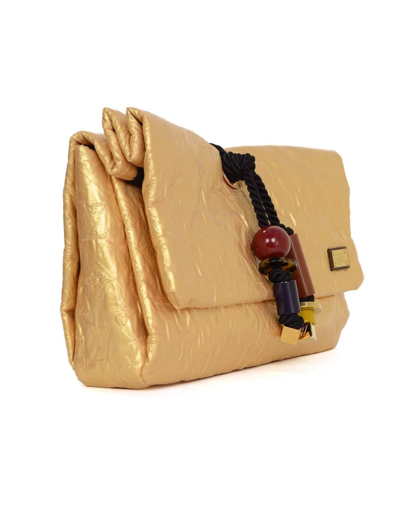 Louis Vuitton Gold Monogram African Queen Limelight Clutch 
Features black twisted silk rop with multi-colored chunky resin beads
This is part of Louis Vuitton's 2009 Printemps-Ete Collection
Made In: France
Year of Production: 2009
Color: