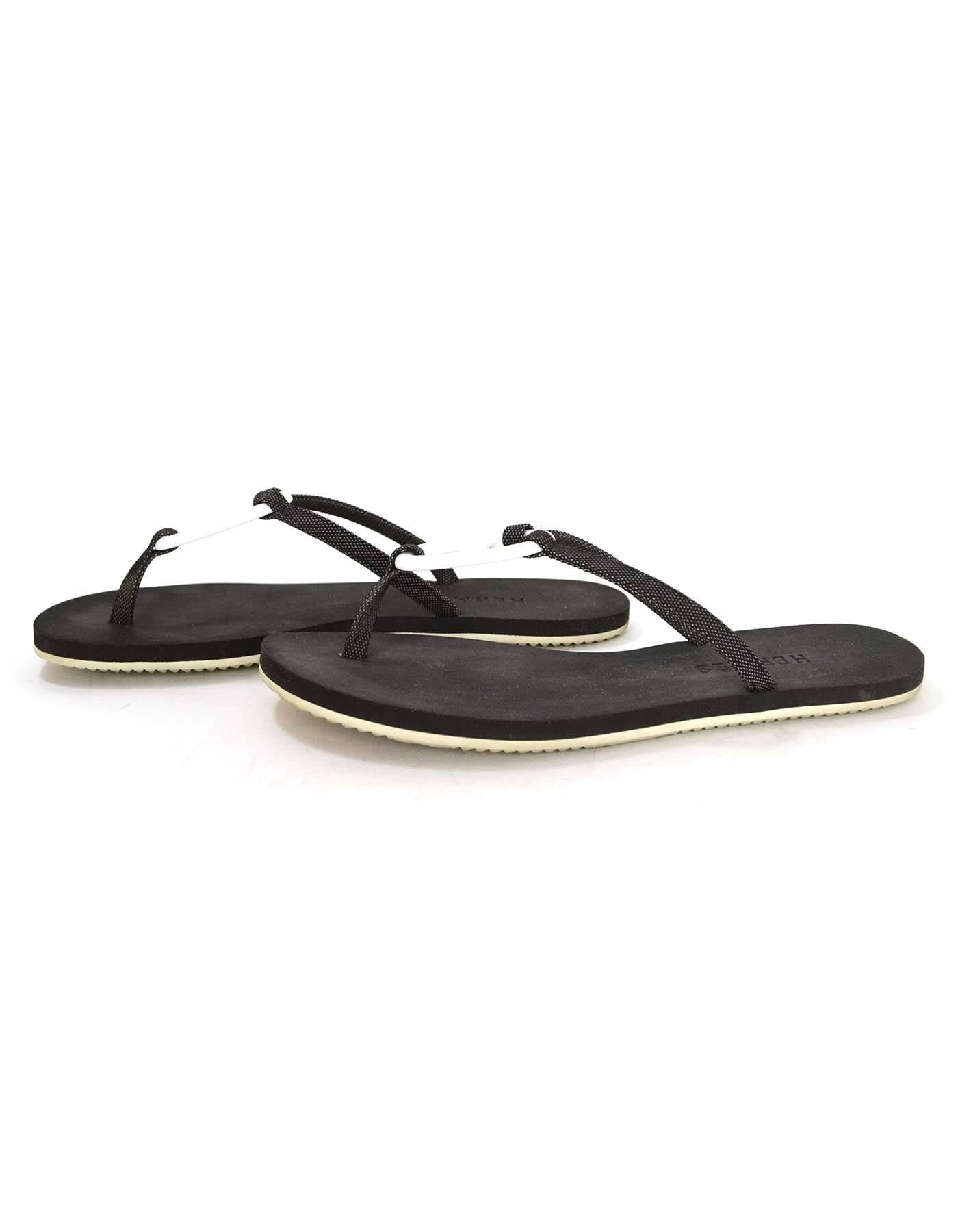 Hermes Black & White Kala Nera Ancre Flip Flops 
Made In: Spain
Color: Black and white
Materials: Rubber/foam, canvas and resin
Closure/Opening: Slip on
Sole Stamp: Made in Spain CAOUTCHOUC
Retail Price: $430 + tax
Overall Condition:
