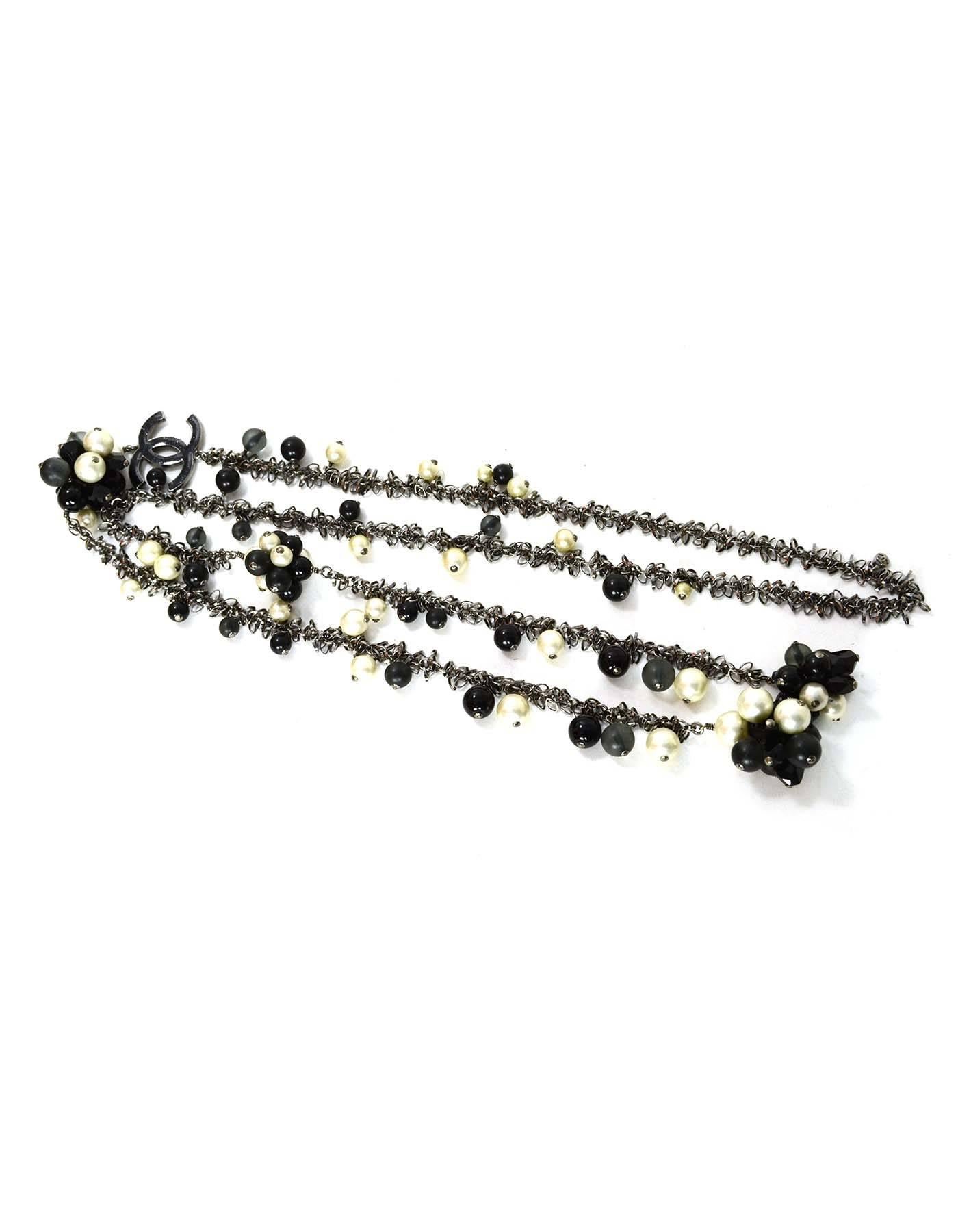 Chanel Pearl & Black Beaded CC Pendant Lariat Necklace
Features grey and black bead and faux pearl clusters throughout 

Color: Gunmetal, black grey and ivory
Materials: Metal, faux pearl and crystal
Closure: None- tie closure
Overall