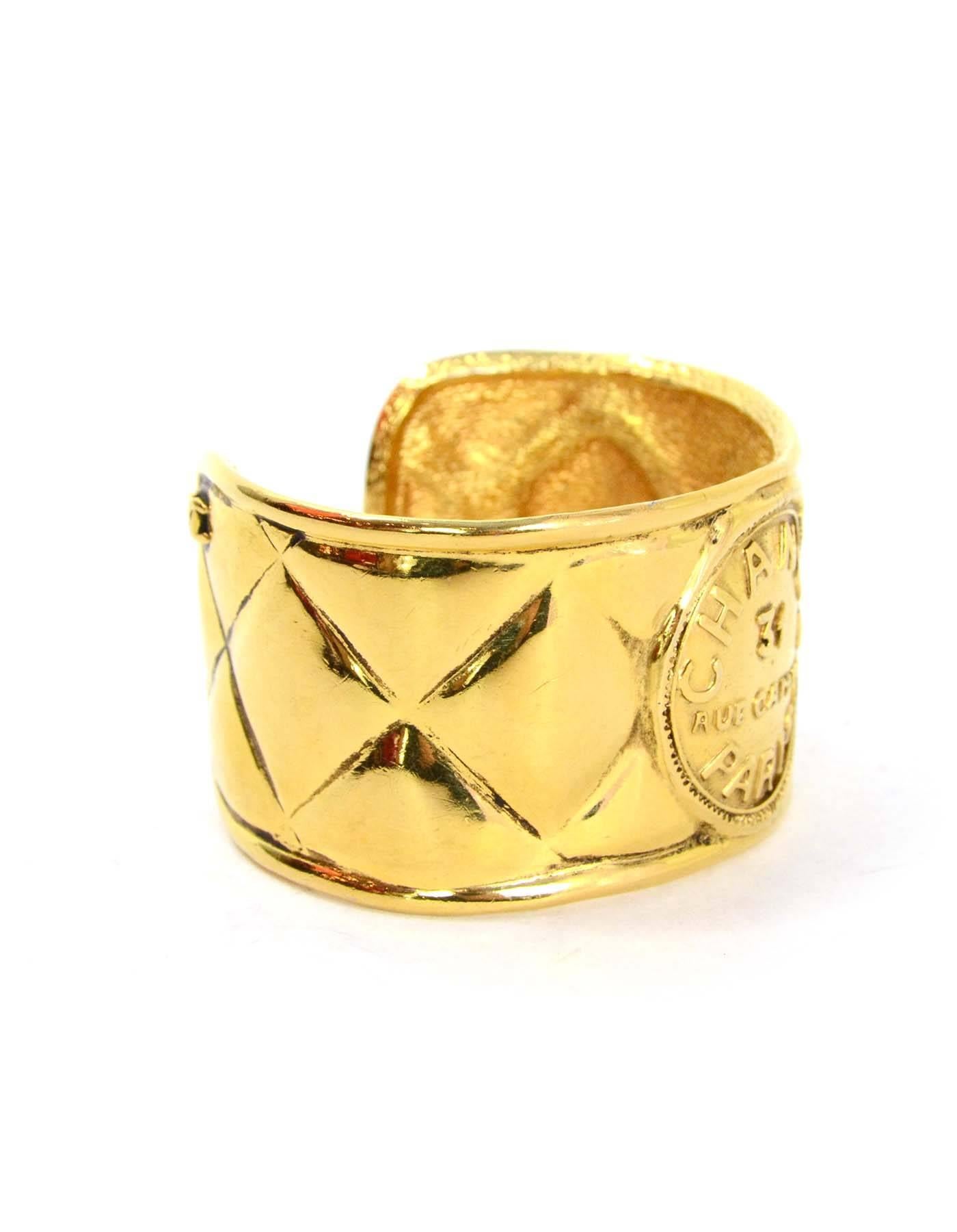 Chanel Vintage 70's Quilted Gold Cuff
Features coin engraved with Chanel text on it
Made In: France
Year of Production: 1970's
Color: Goldtone
Materials: Metal
Closure: None
Stamp: Chanel CC Made in France
Overall Condition: Very good