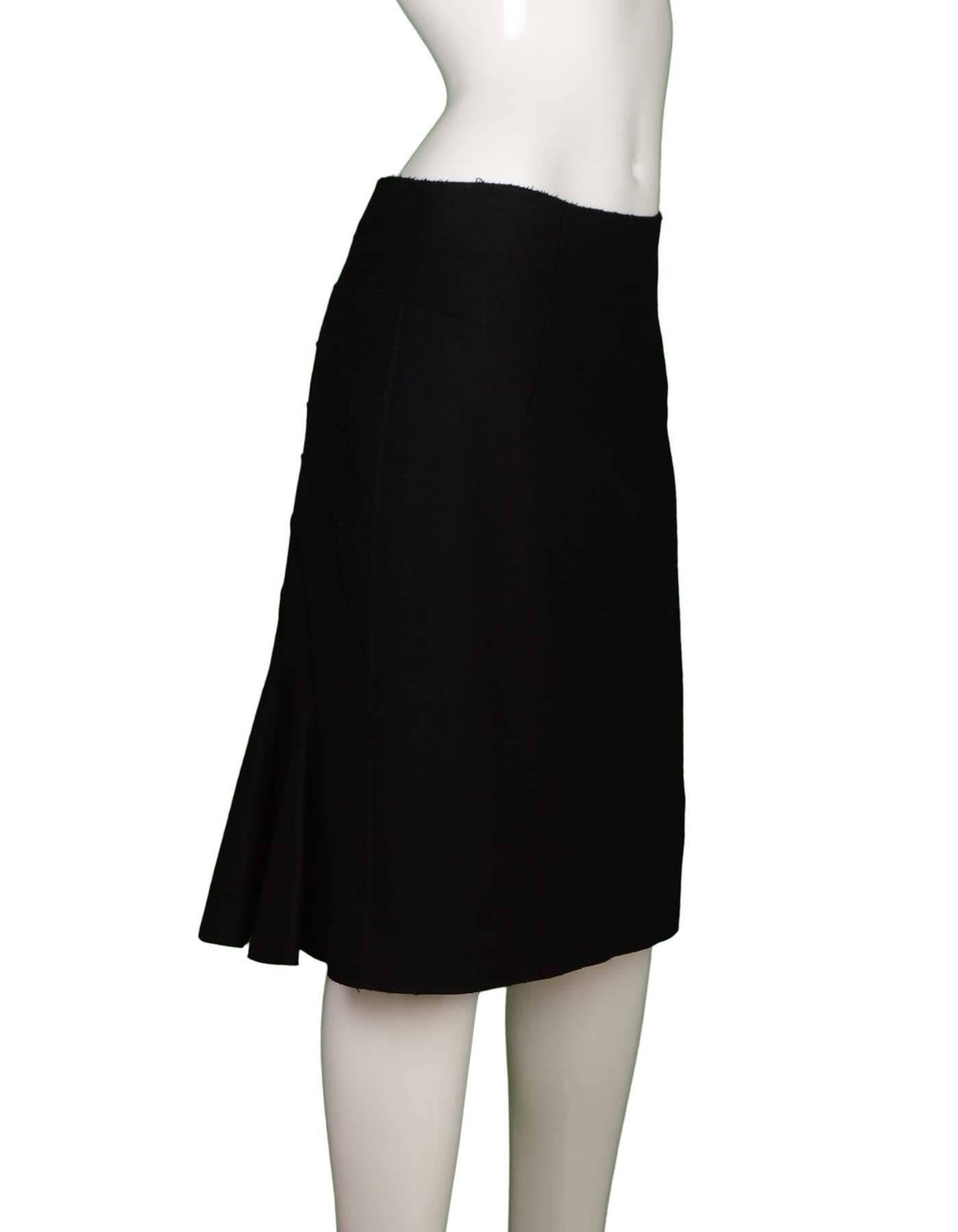 Alberta Ferretti Black Wool Skirt  
Features detailed scallop-like stitching in back with a small trumpet flare at bottom of back hem
Made In: Italy
Color: Black
Composition: 75% wool, 25% nylon
Lining: Black, 100% rayon
Closure/Opening: Side