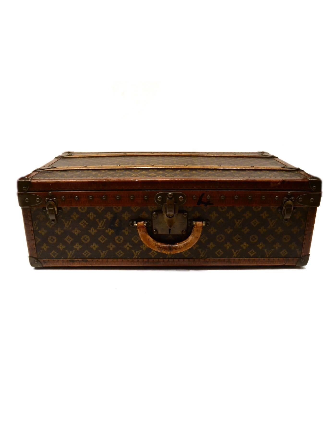 Louis Vuitton Vintage Monogram Hard Suitcase/Trunk
Features optional insert tray

Made In: France
Color: Brown and tan
Hardware: Brass
Materials: Leather, coated canvas, wood and metal
Lining: Brown felt lining
Closure/Opening: Triple trunk latch