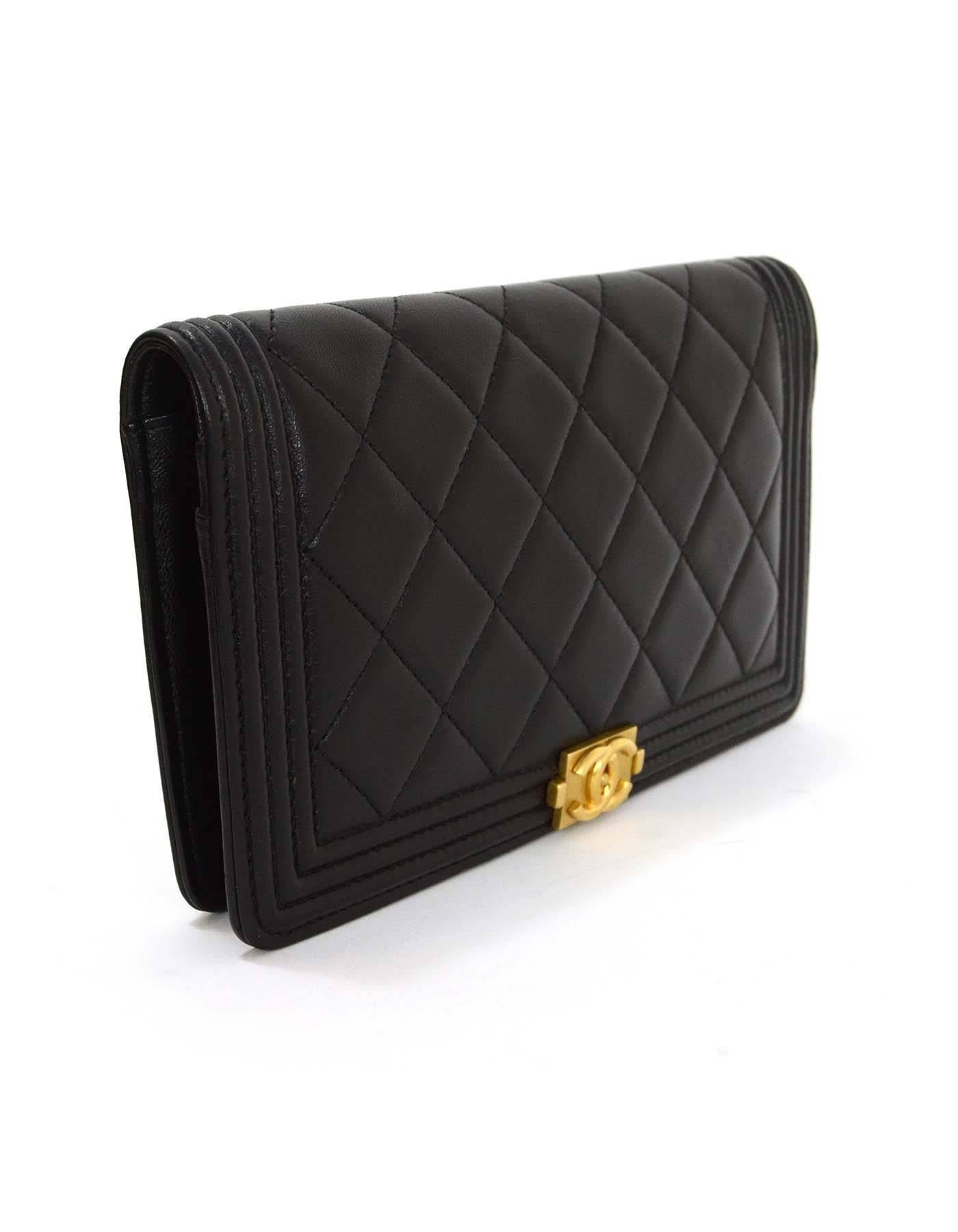 Chanel Black Lambskin Quilted Boy Yen Wallet GHW 
Features lambskin leather with a gold hardware CC logo

    Made in: Italy
    Year of Production: 2015
    Color: Black
    Hardware: Goldtone
    Materials: Lambskin
    Lining: Black