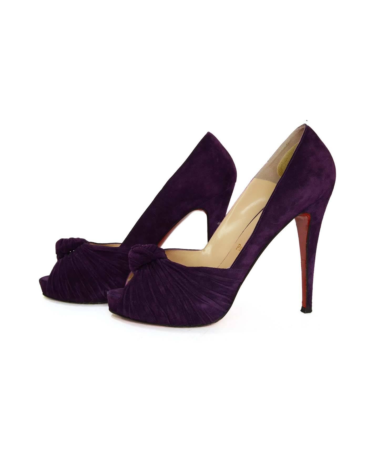 Christian Louboutin Purple Suede Peep-Toe Pumps 
Features a knot and ruched suede at peep-toe
Made In: Italy
Color: Purple
Materials: Suede
Closure/Opening: Slip on
Sole Stamp: Christian Louboutin Vero cuoio Made in Italy 39
Overall