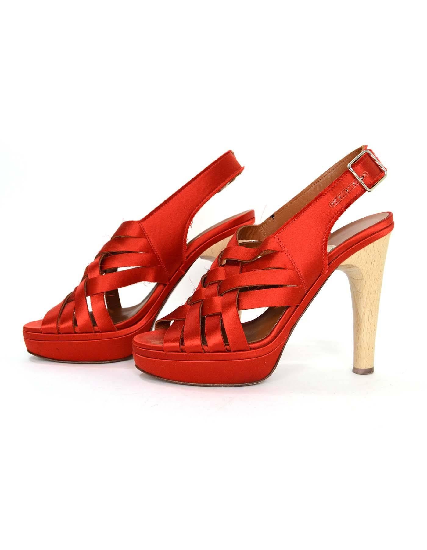 Lanvin Red Satin Strappy Sandals
Features raw edges throughout satin creating a fraying effect
Made In: Italy
Color: Red
Materials: Satin and wood
Closure/Opening: Ankle strap with buckle and notch closure
Sole Stamp: Vero Cuoio Made in Italy