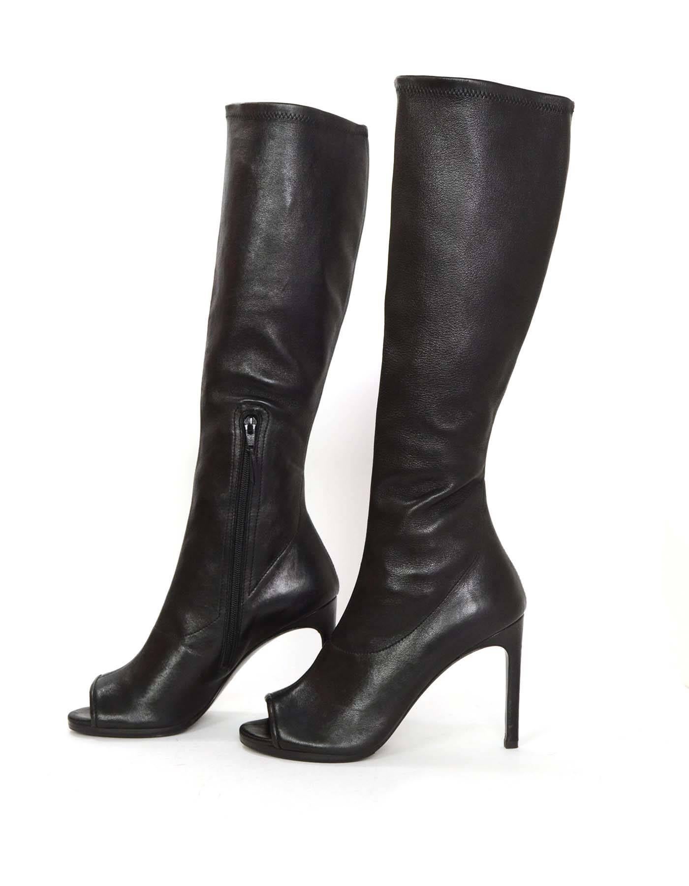 Stuart Weitzman Black Leather Peep-Toe Boots
Made In: Spain
Color: Black
Materials: Leather
Closure/Opening: Pull on with inside ankle zipper half way up
Sole Stamp: Stuart Weitzman Leather Sole Made in Spain
Overall Condition: Excellent
