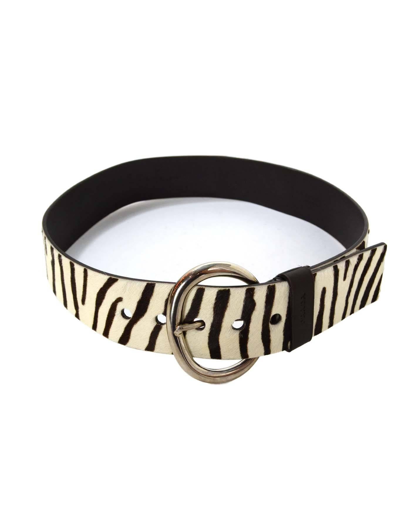 Prada Zebra Print Pony Hair Belt 
Made In: Italy
Color: Brown and white
Hardware: Silvertone
Materials: Pony hair, leather and metal
Closure/Opening: Buckle and notch
Stamp: 1C2312 F9G
Overall Condition: Excellent pre-owned