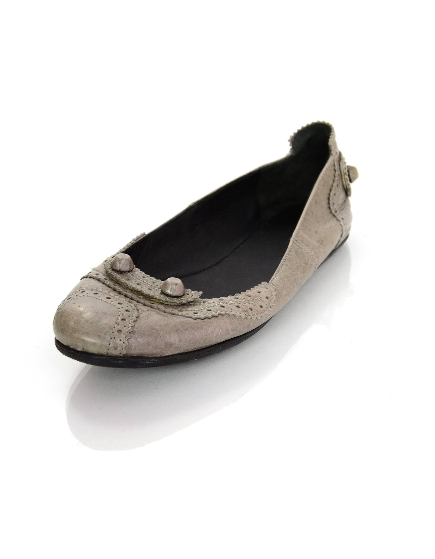 Balenciaga Grey Distressed Leather Flats 
Features leather covered studs throughout

Color: Grey
Materials: Distressed leather and metal
Closure/Opening: Slide on
Insole Stamp: Balenciaga Paris
Overall Condition: Very good pre-owned condition with